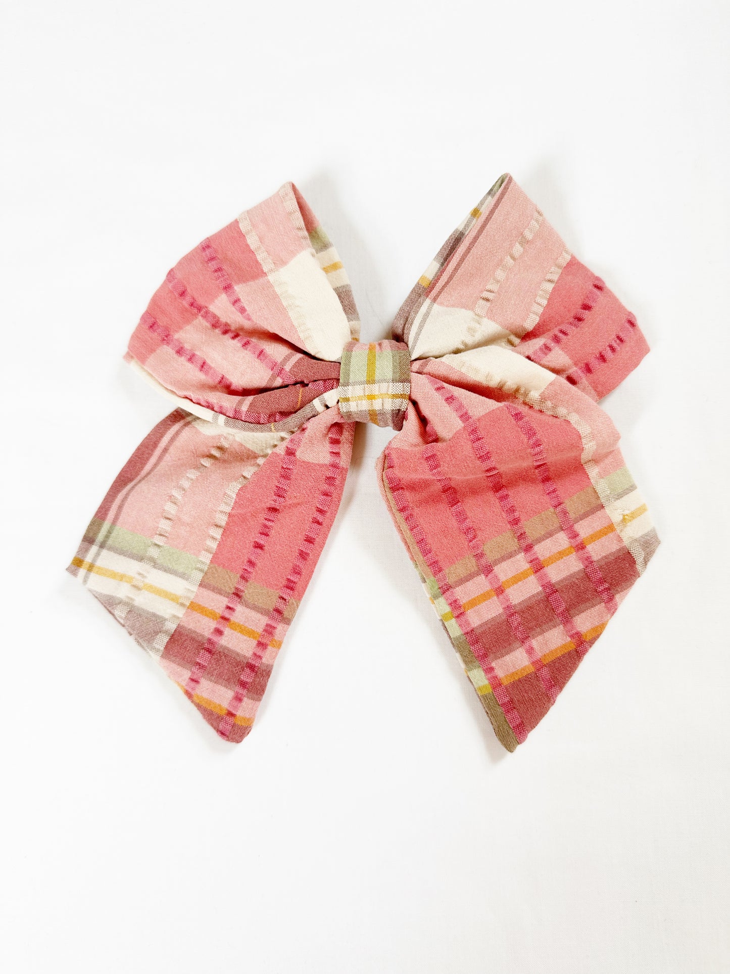 Beau hair bow in pink, brown and green tartan.