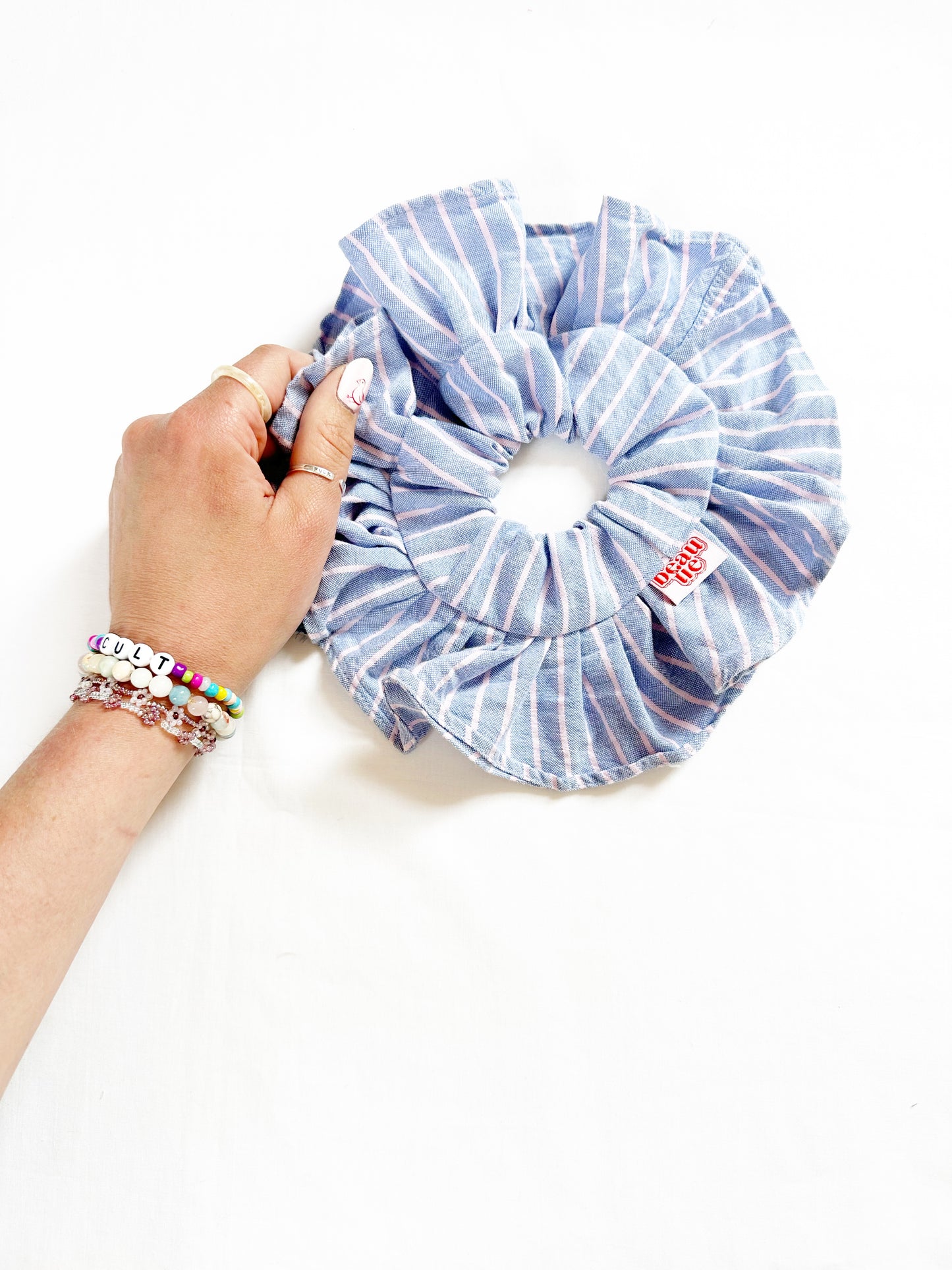 Mini ruffle scrunchie in blue and pink stripe cotton