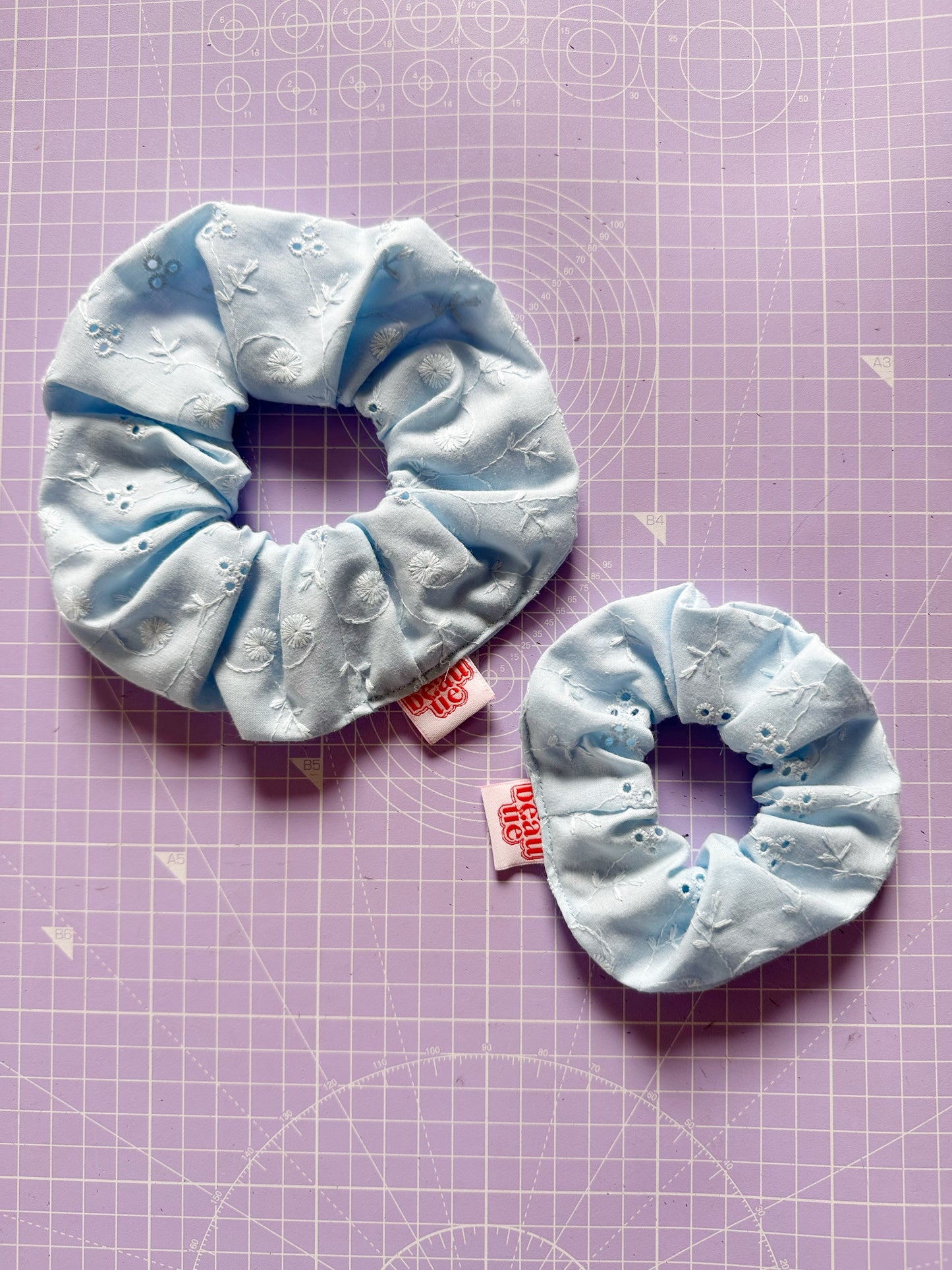 OG scrunchie in baby blue broderie