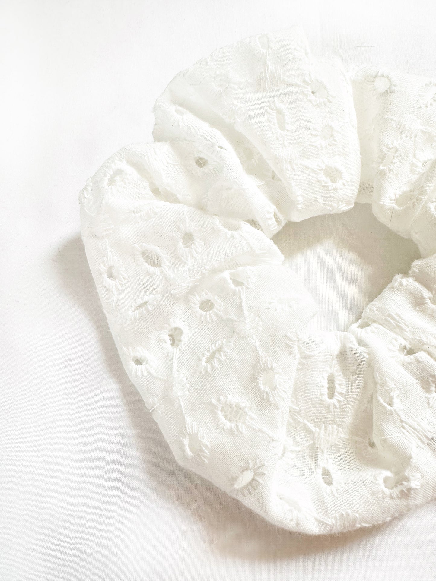 OG scrunchie in white broderie cotton