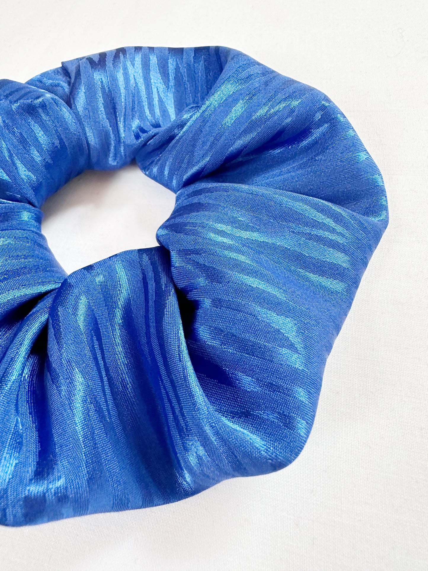 OG scrunchie in electric blue silky zebra