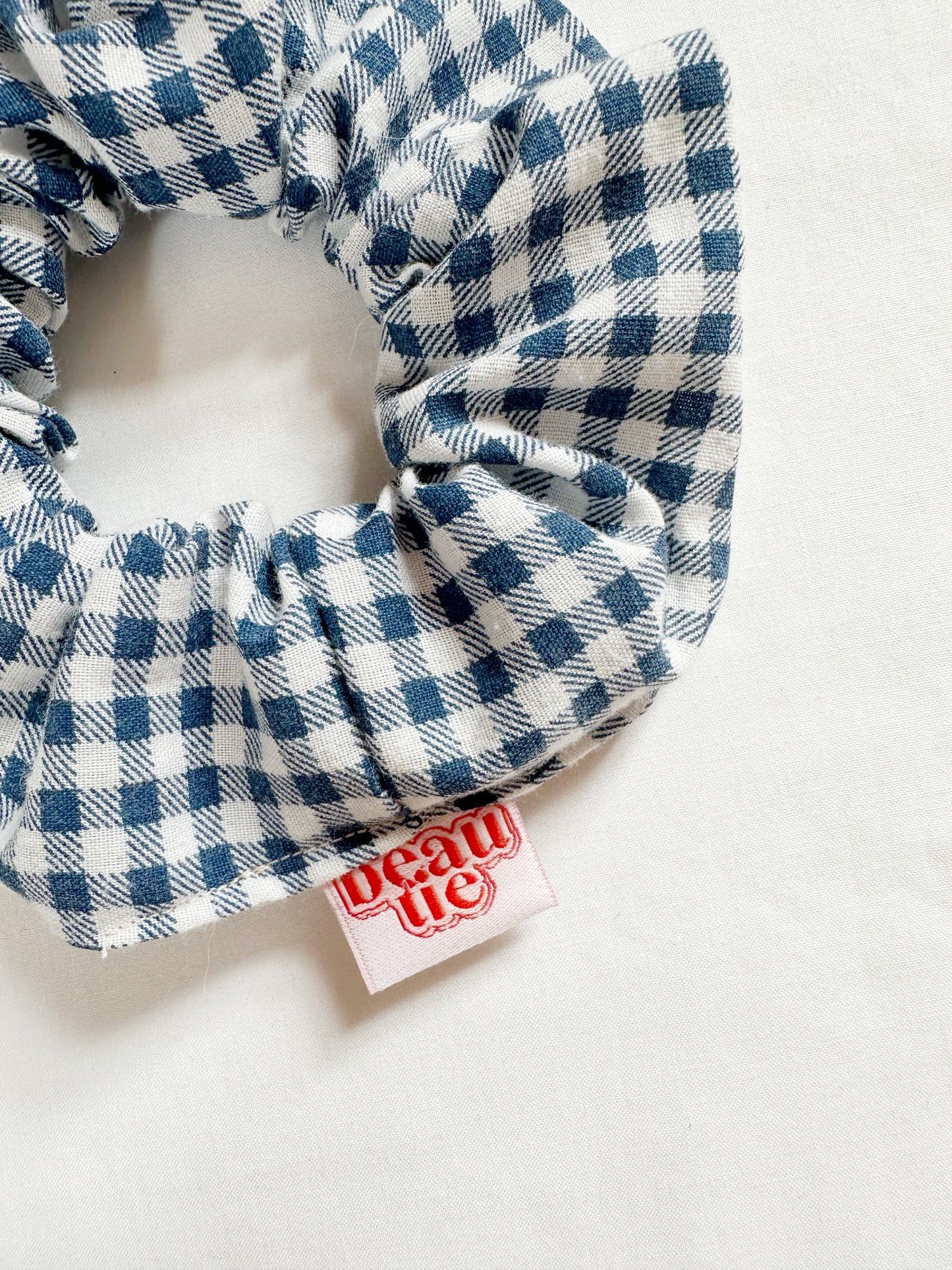 OG scrunchie in navy gingham