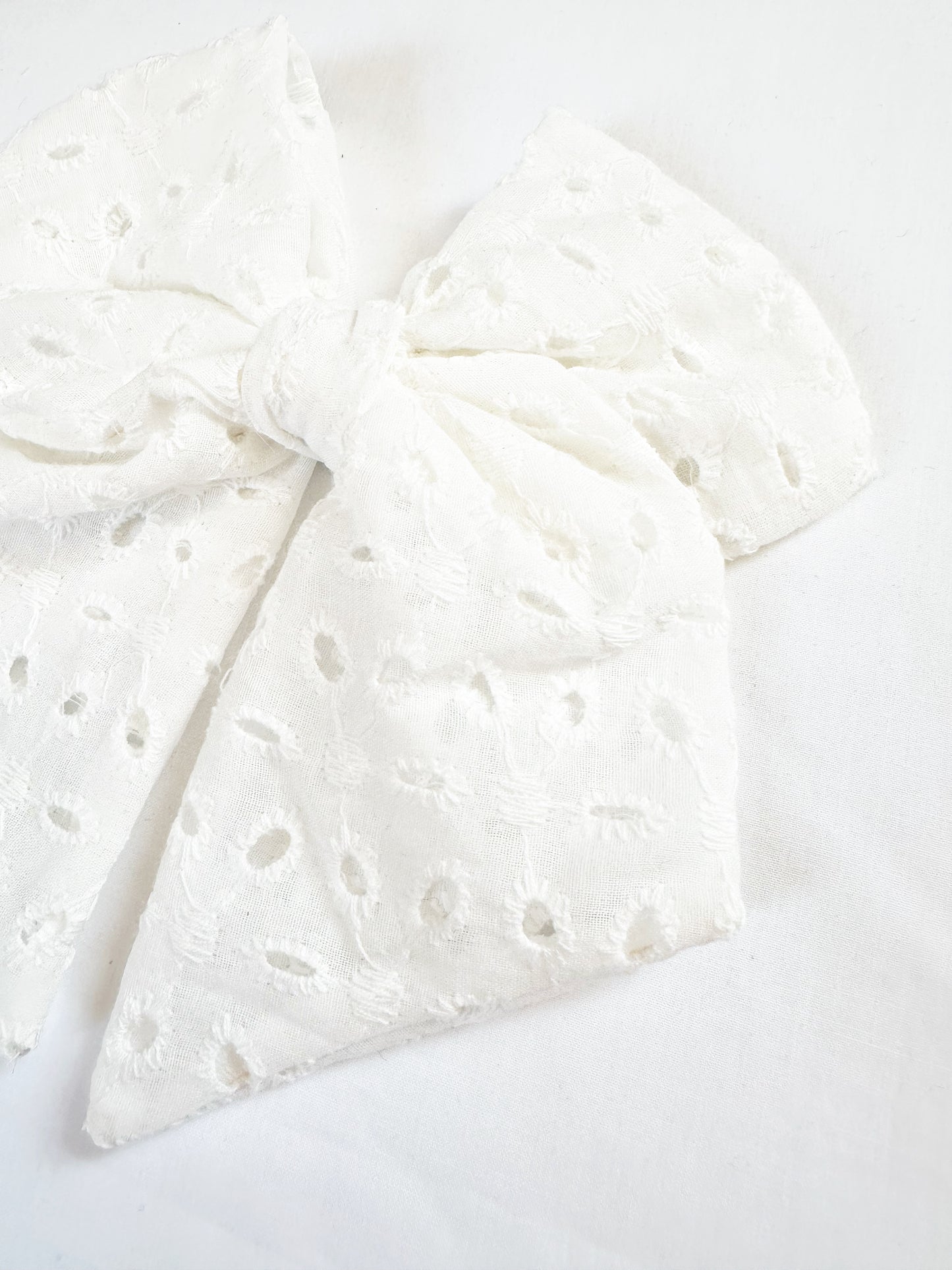 Beau hair bow in white broderie