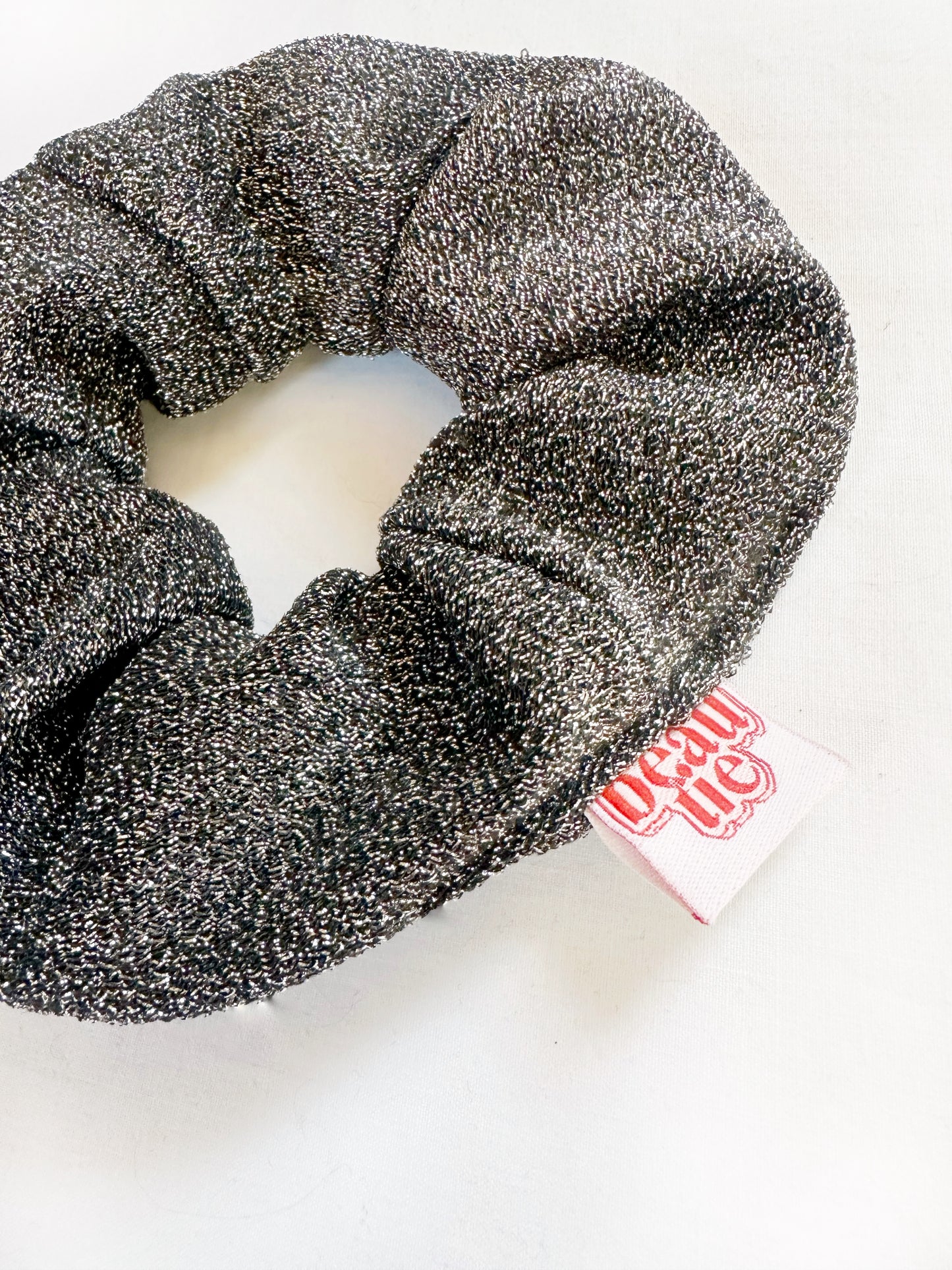 OG scrunchie in silver glitter