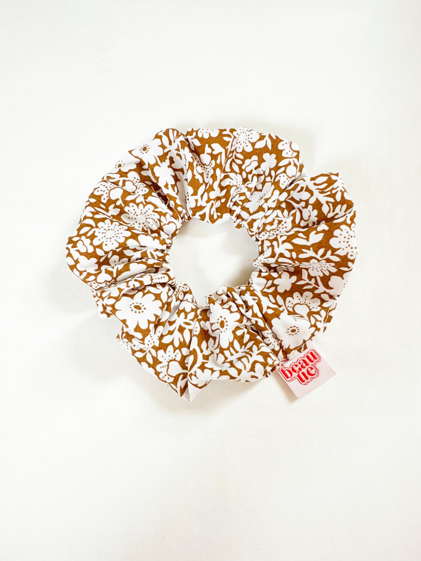 OG scrunchie in brown and white floral
