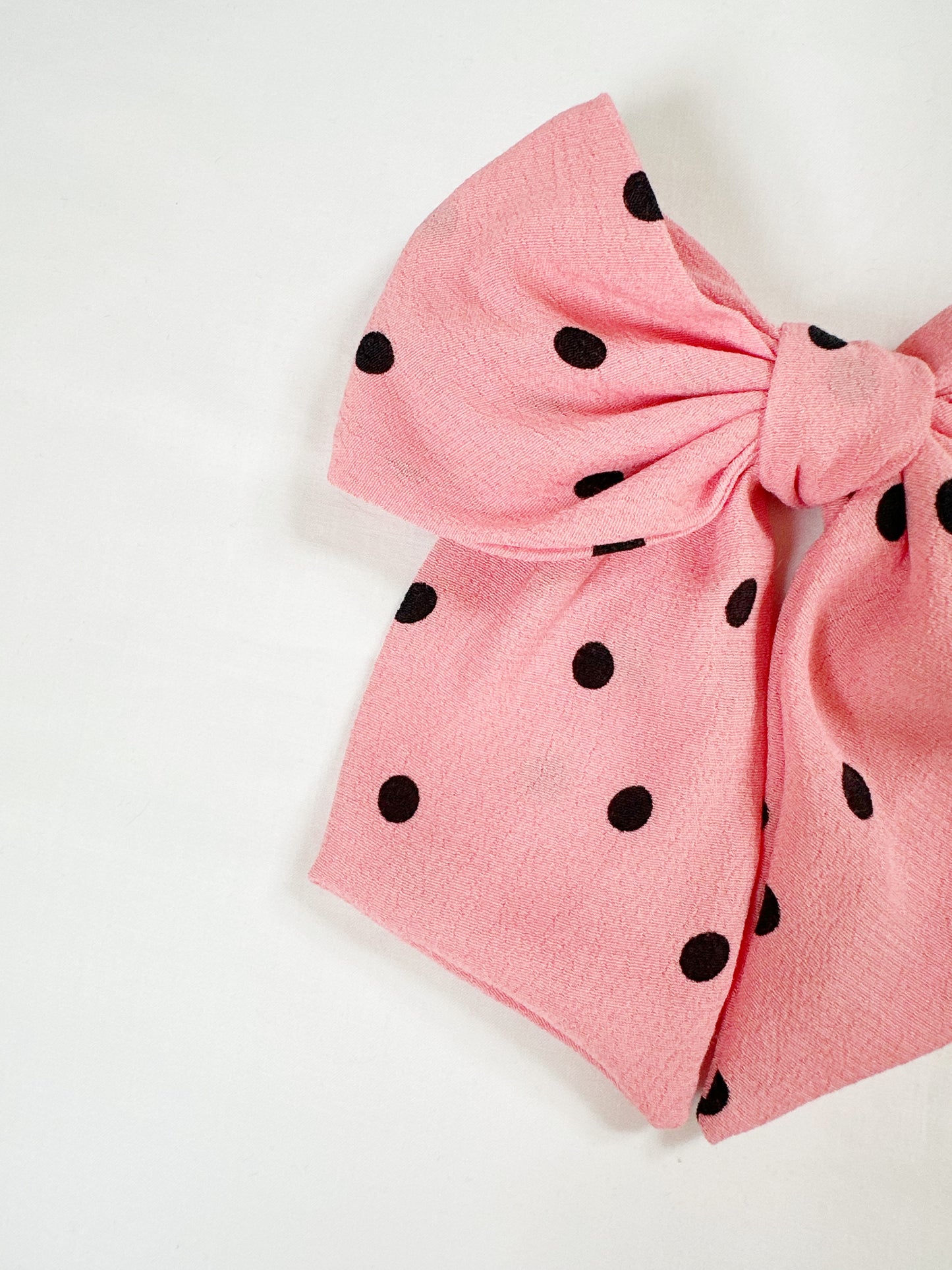 Beau hair bow in pink polka dot