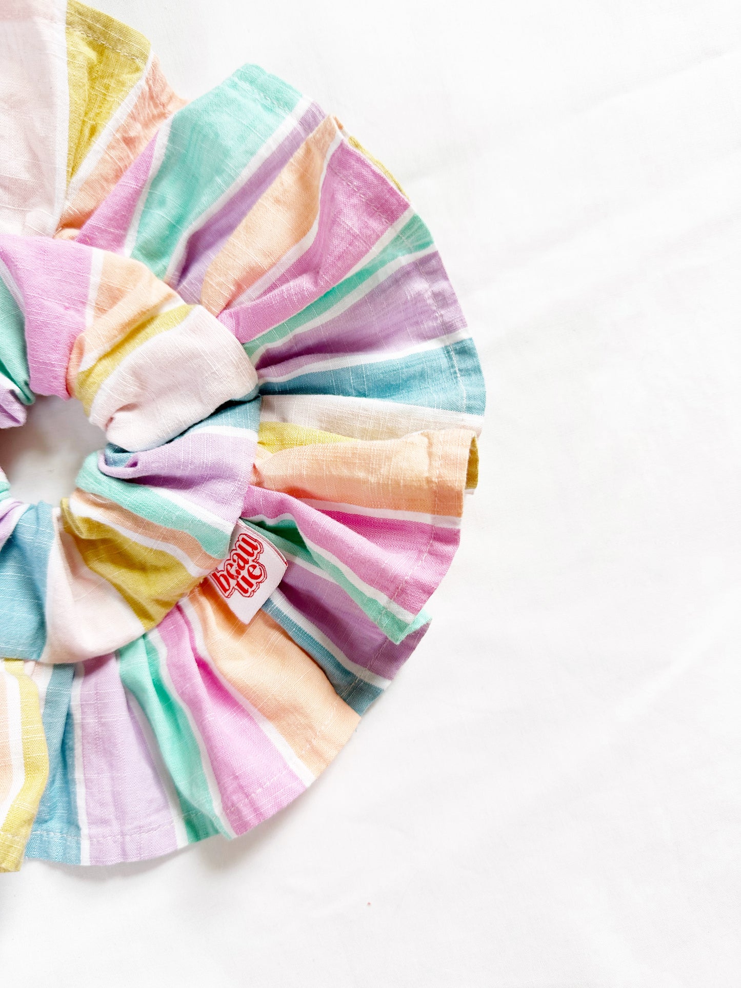 Frilly scrunchie in pastel stripe