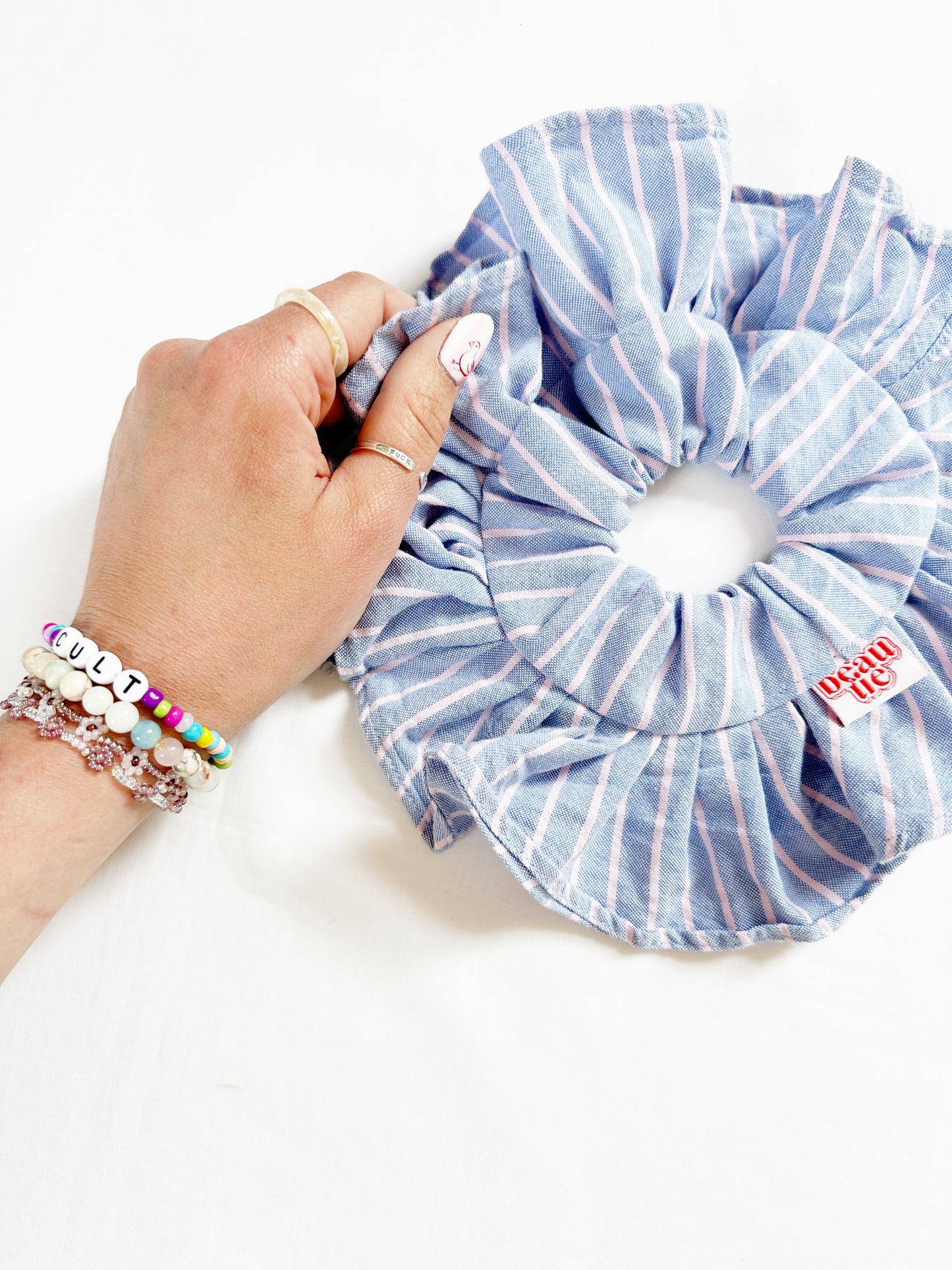 Mini ruffle scrunchie in blue and pink stripe cotton