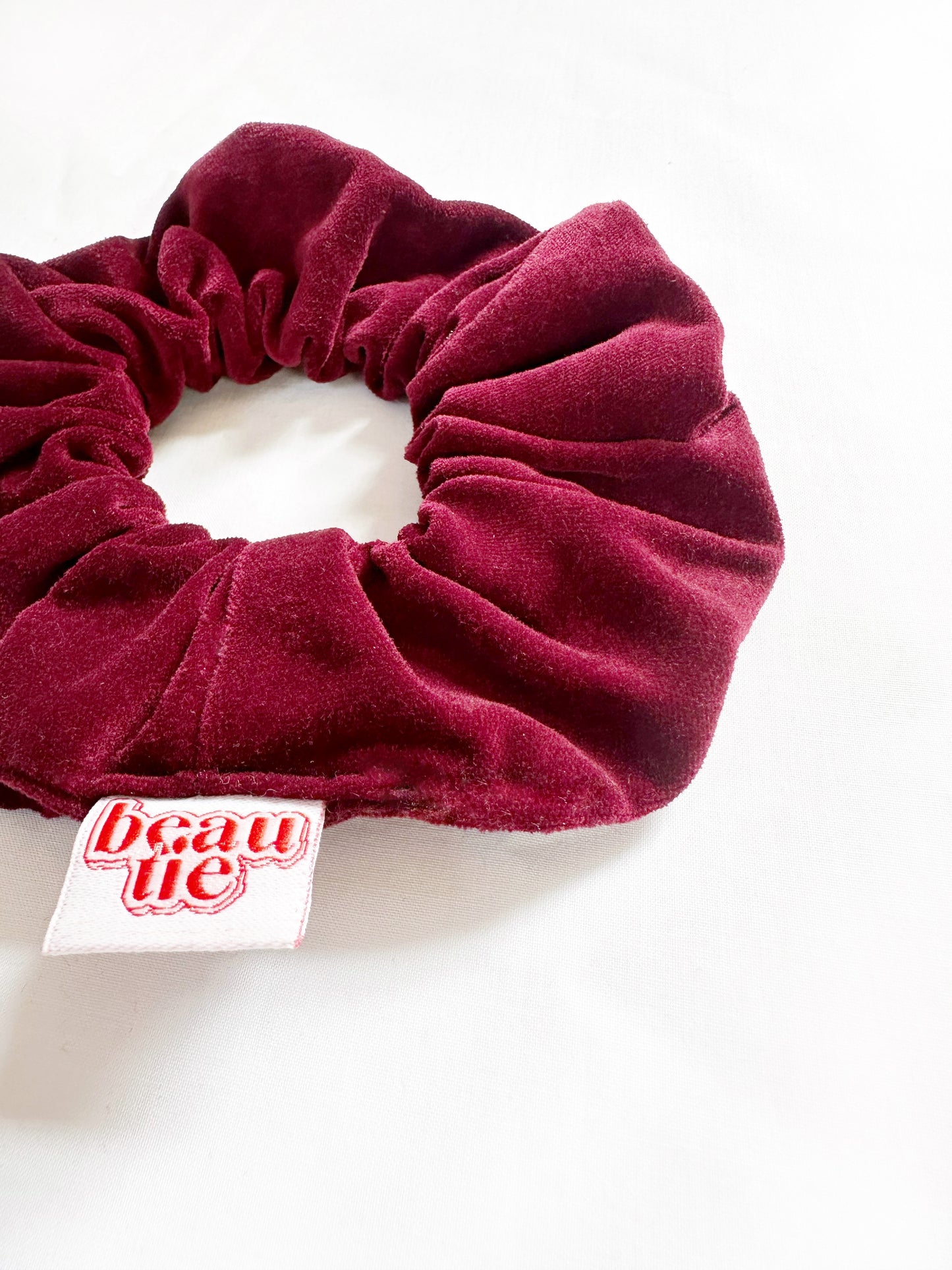 OG scrunchie in burgundy velvet