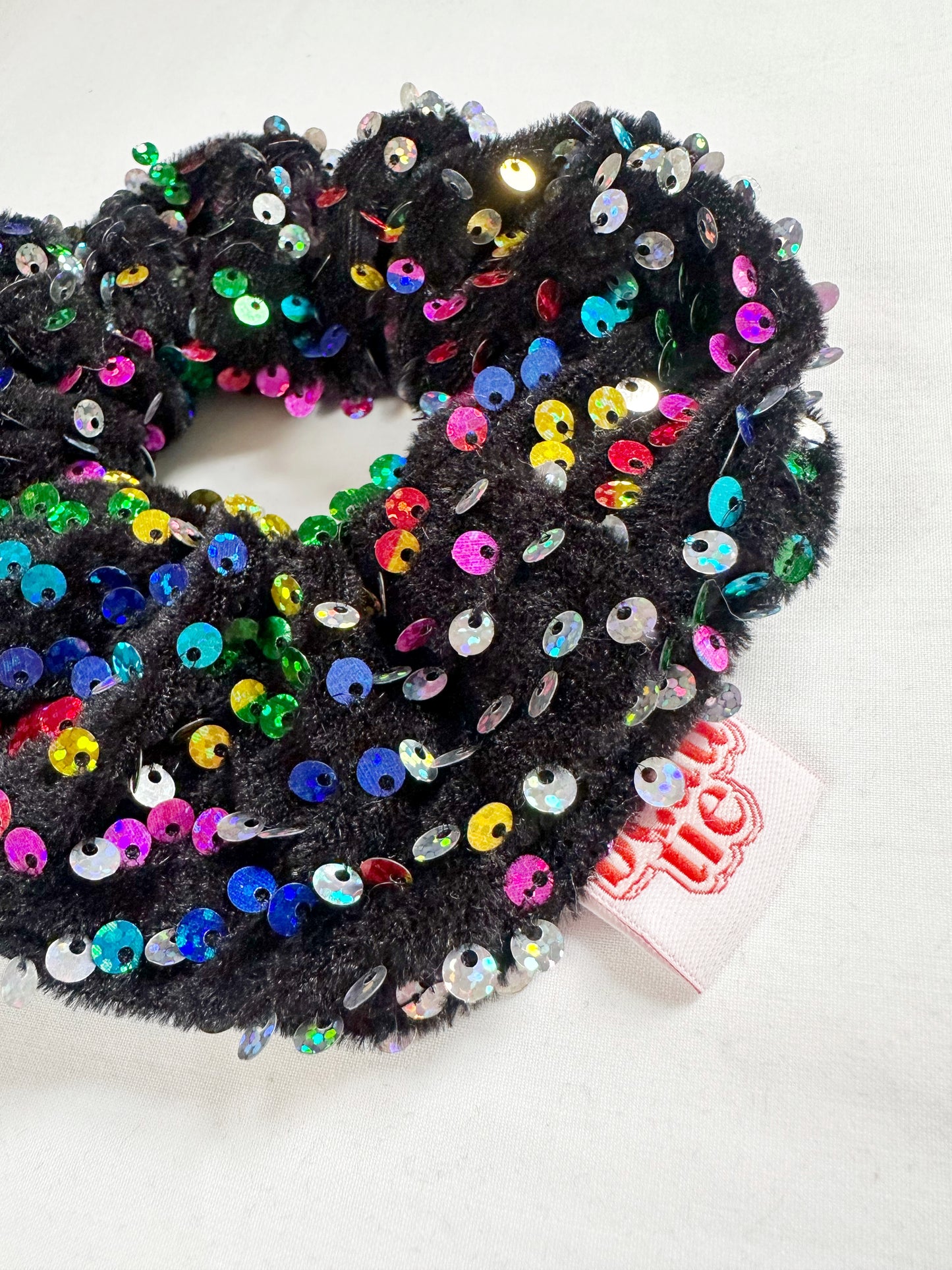 OG scrunchie in rainbow sequins