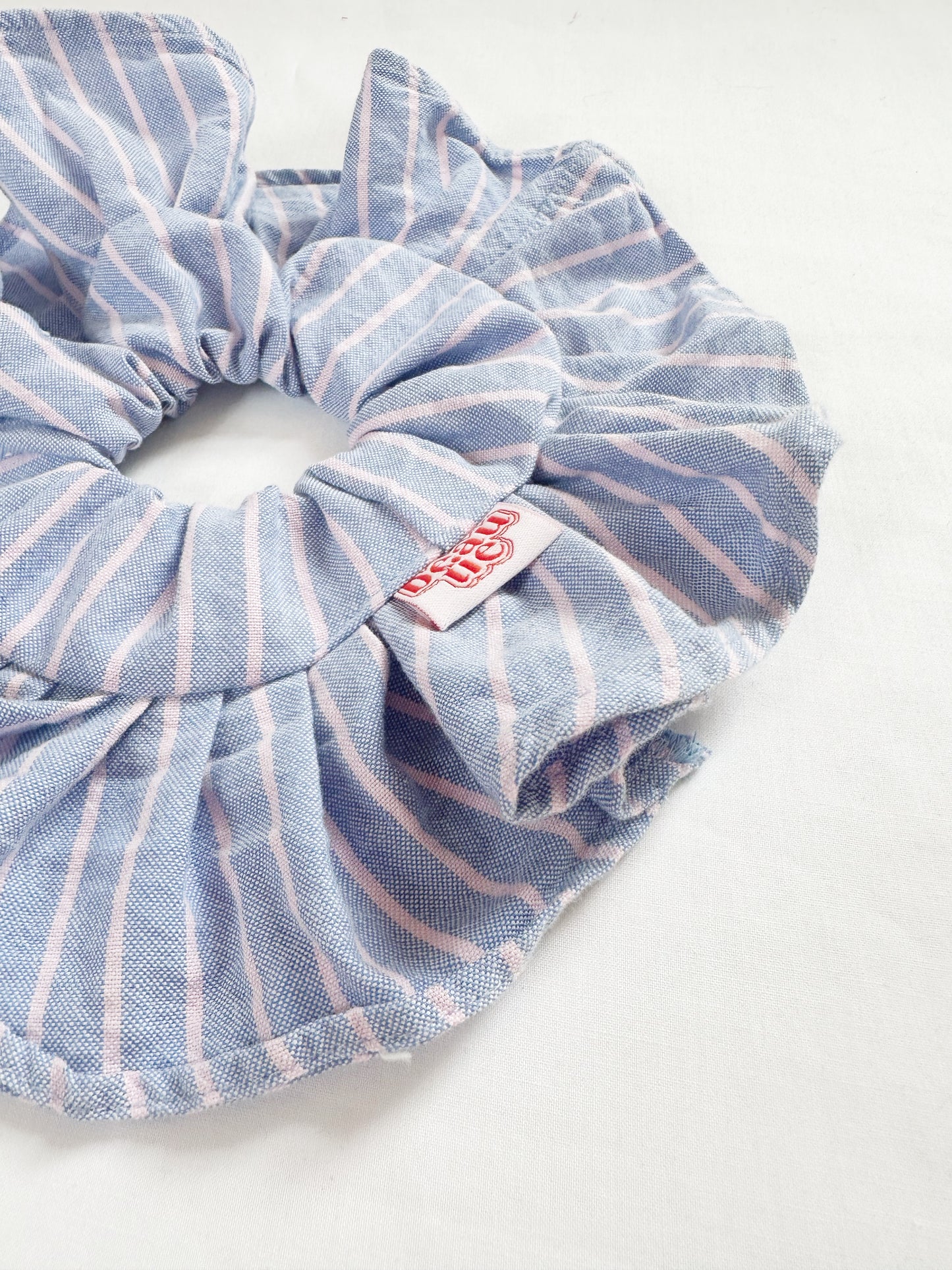 Mini ruffle scrunchie in blue and pink stripe cotton