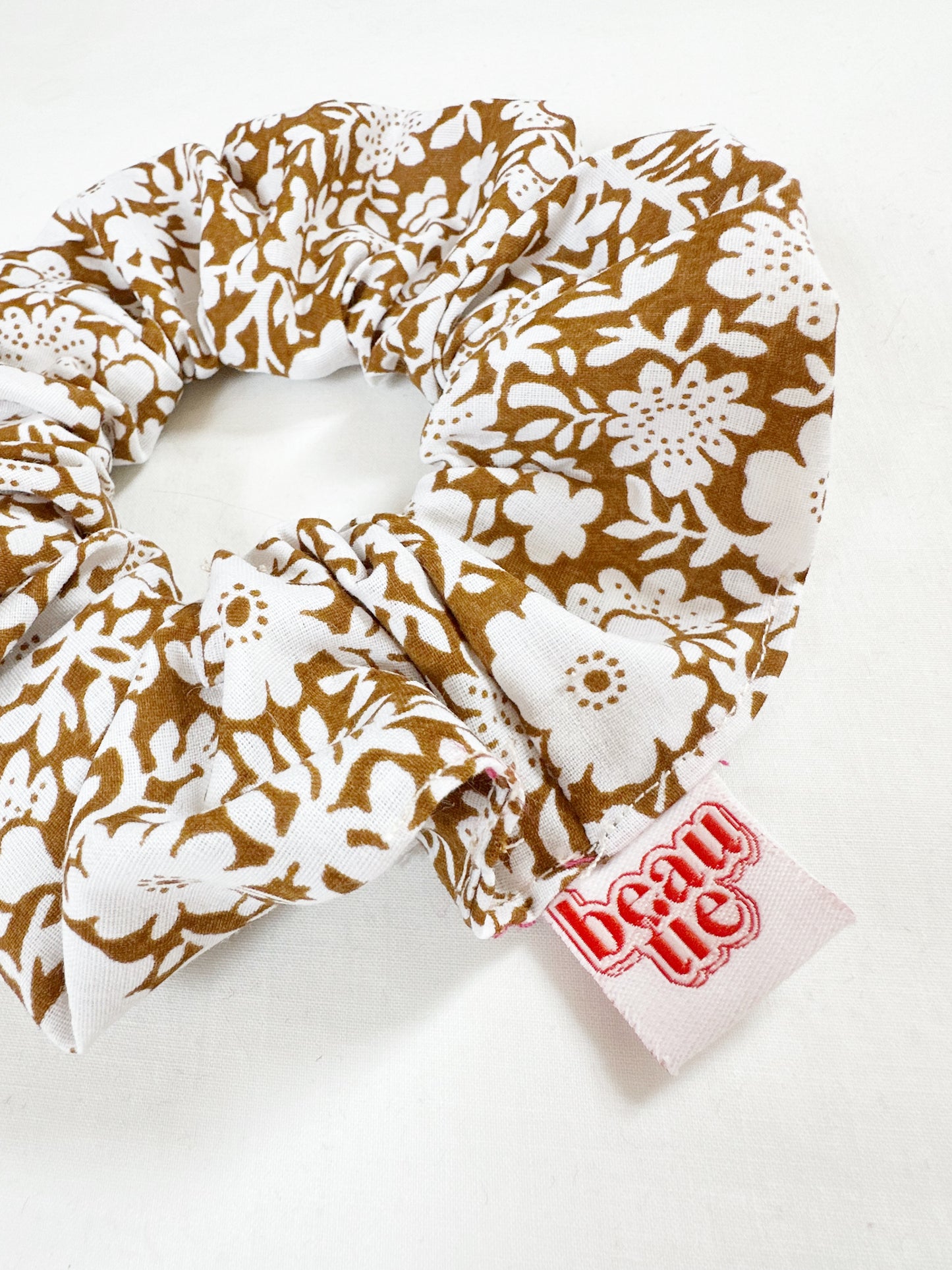 OG scrunchie in brown and white floral