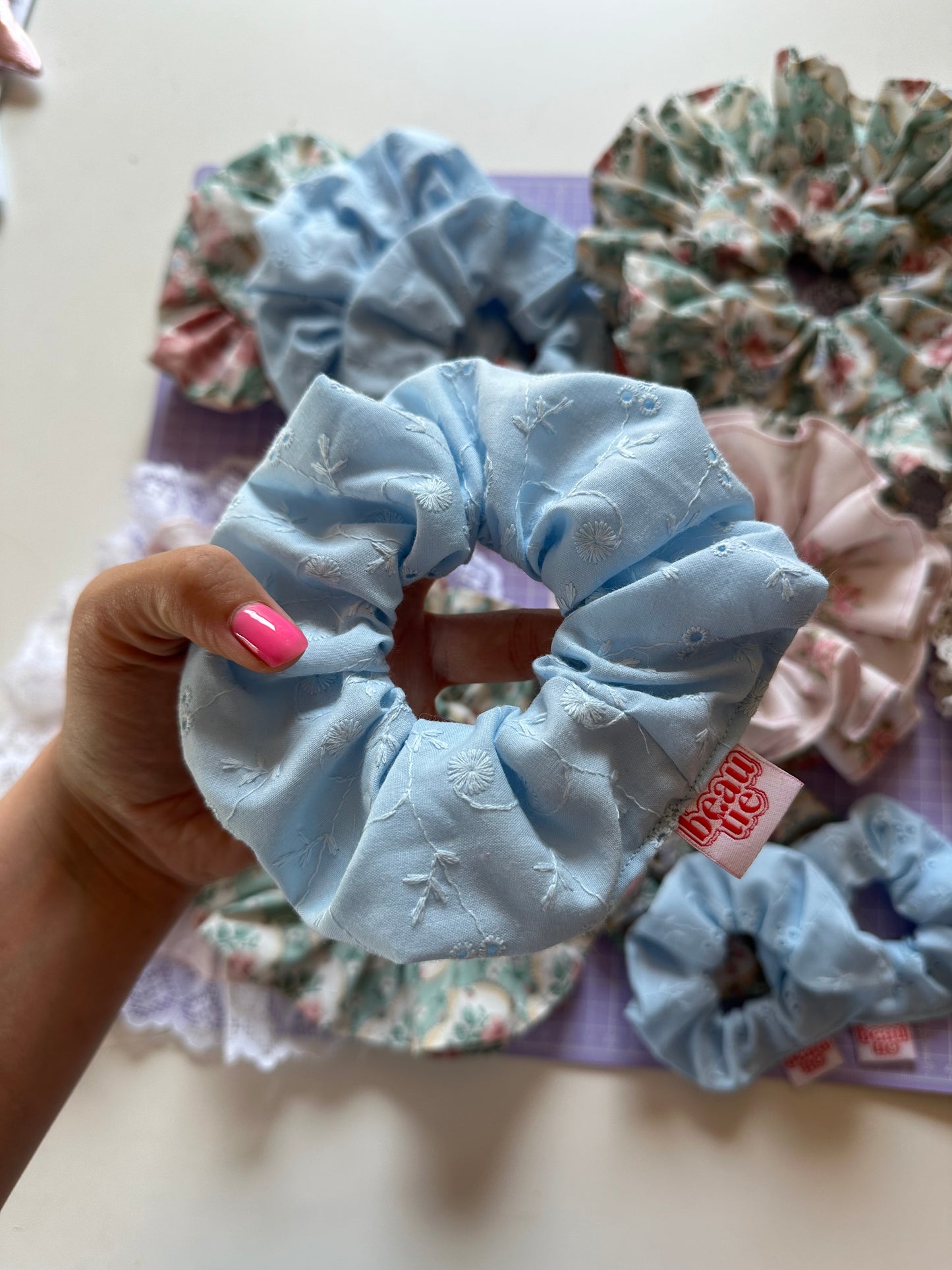 OG scrunchie in baby blue broderie