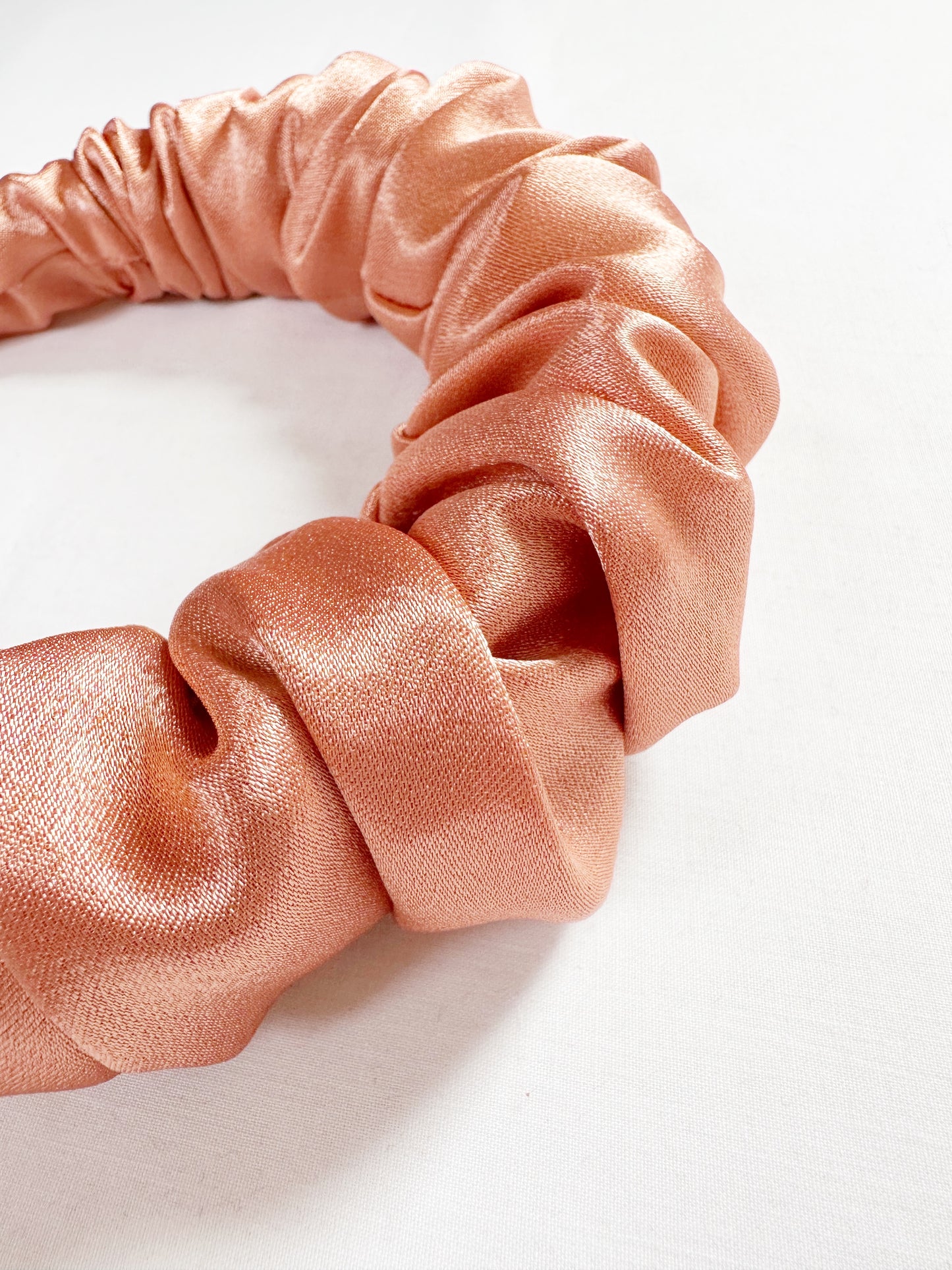 Ruffled Headband in pearly peach satin