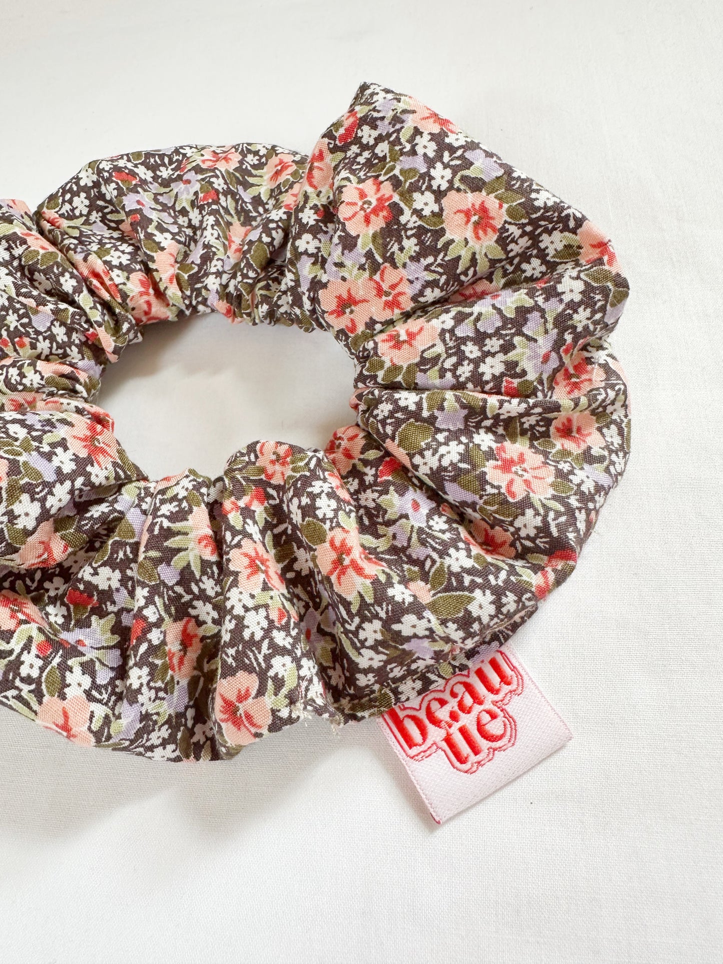 OG scrunchie in peach and lilac floral