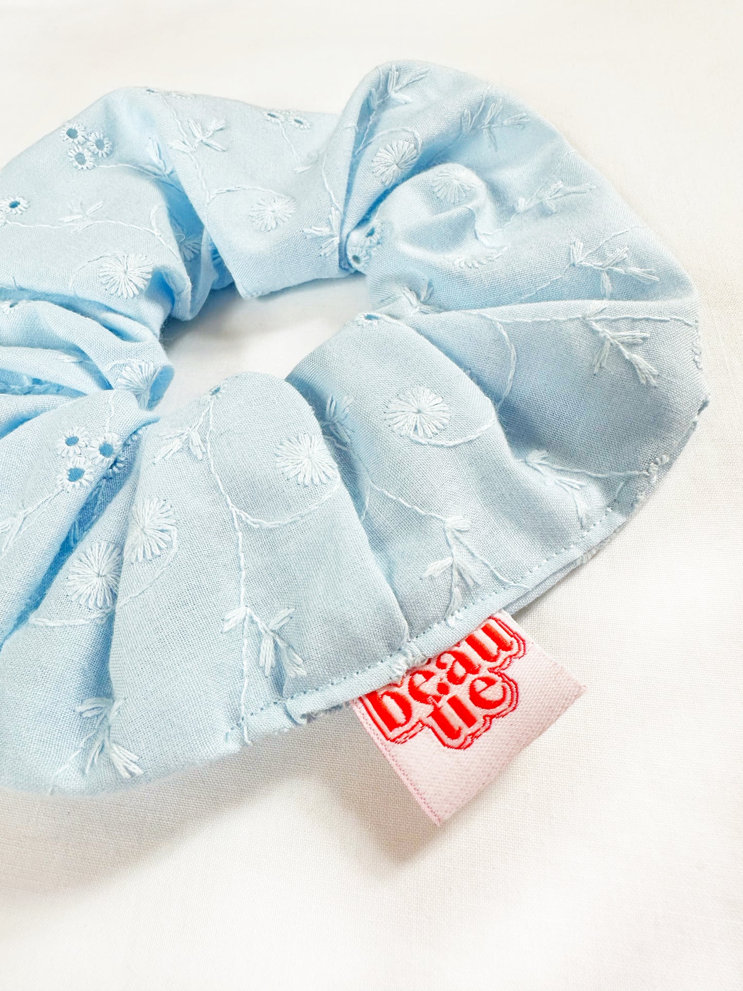 OG scrunchie in baby blue broderie