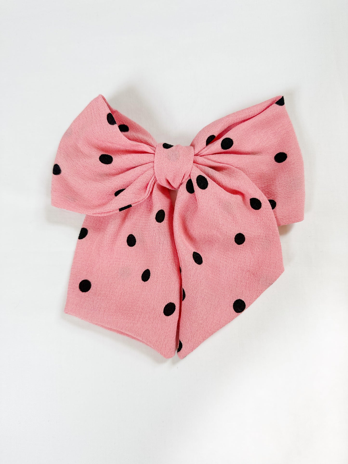 Beau hair bow in pink polka dot