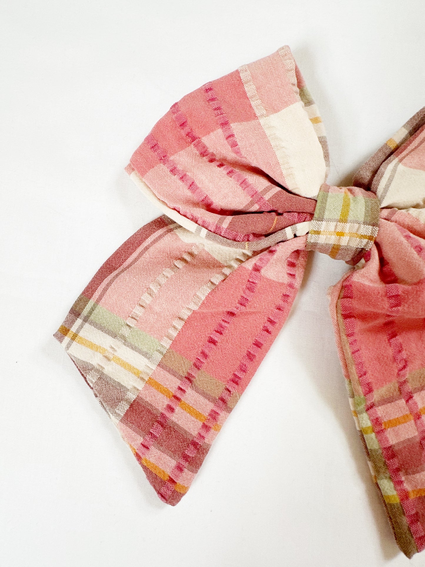 Beau hair bow in pink, brown and green tartan.