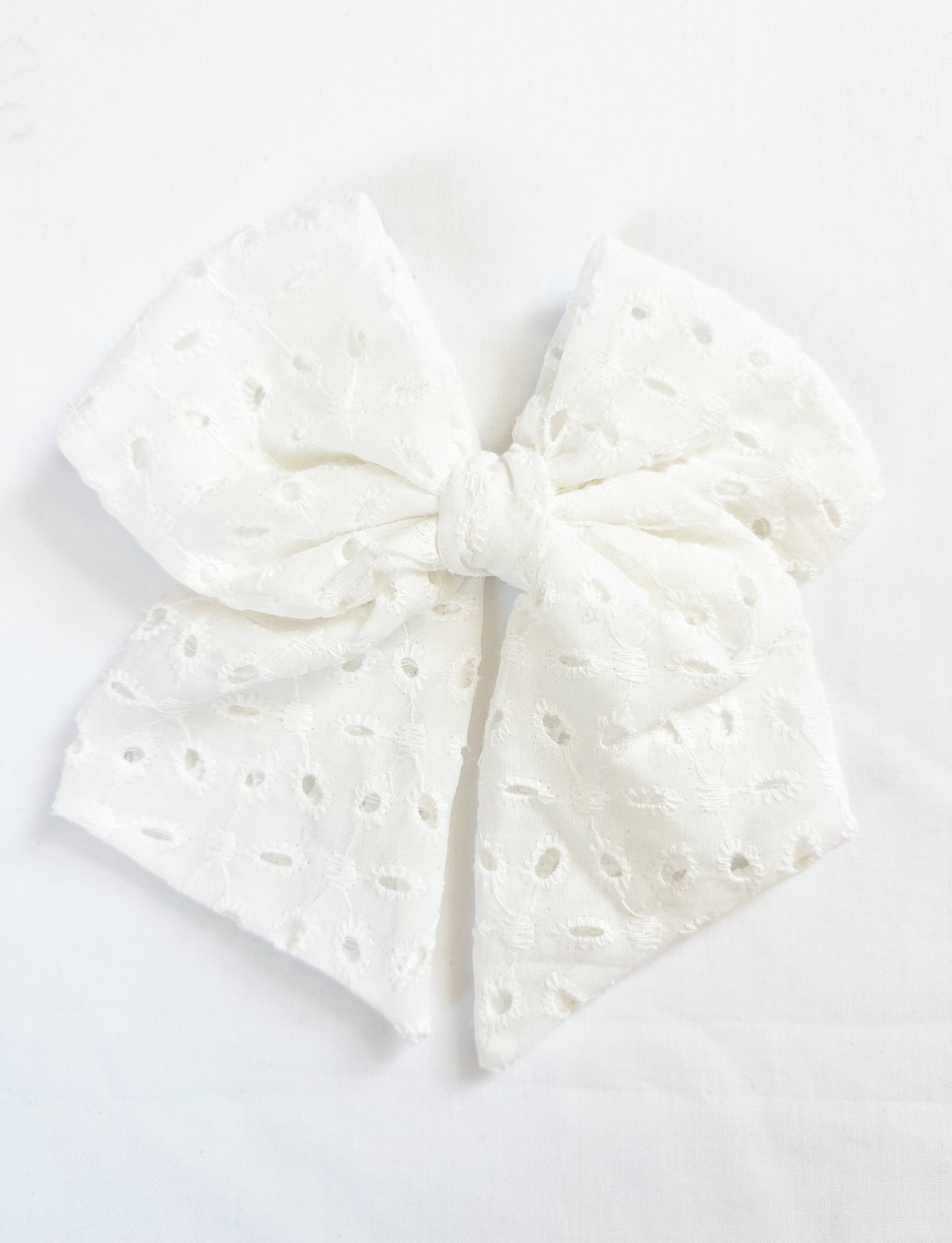 Beau hair bow in white broderie