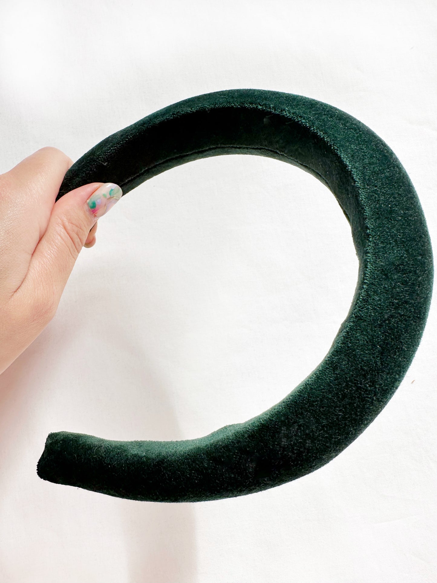 Padded headband in hunter green velvet