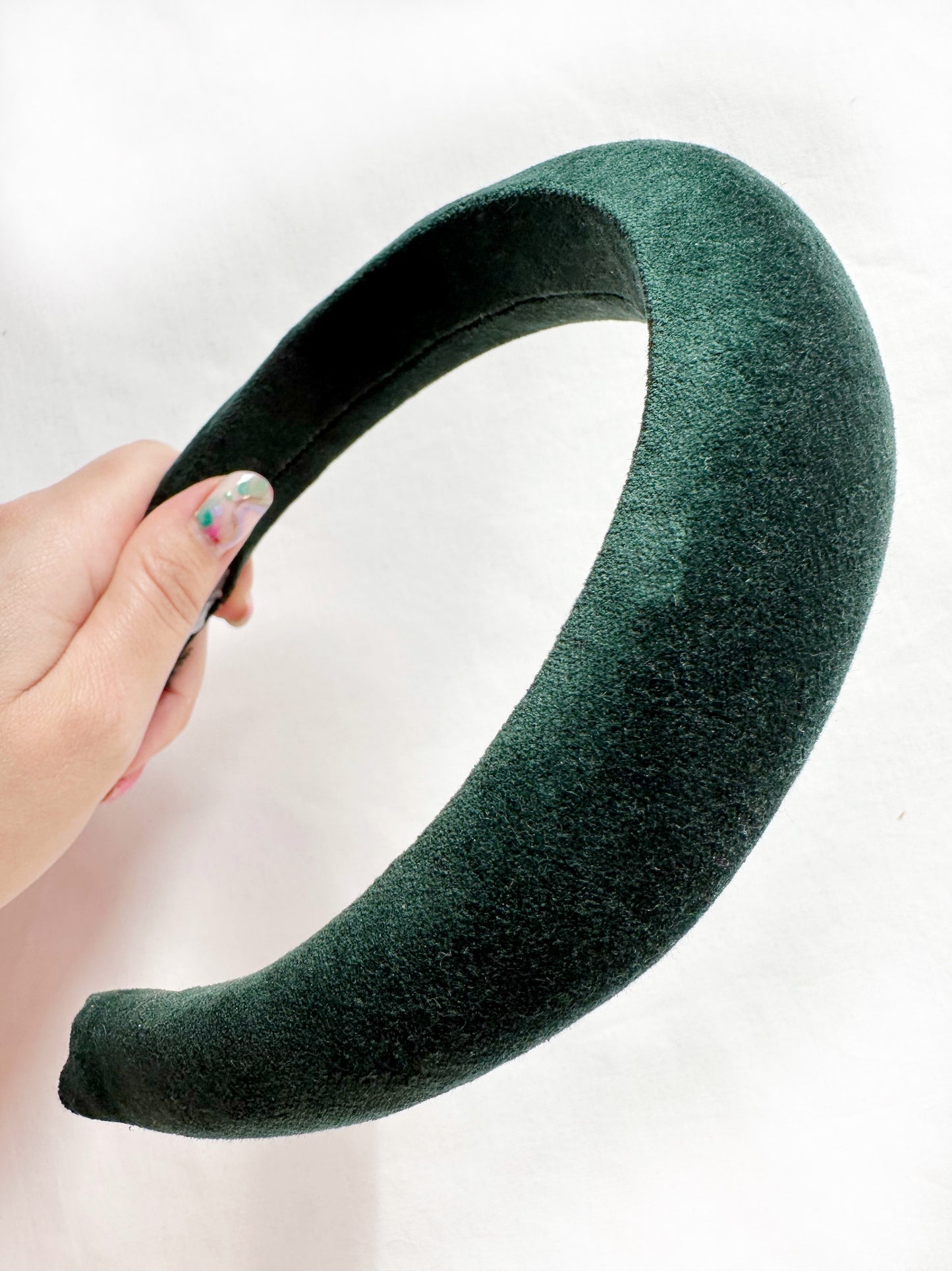 Padded headband in hunter green velvet