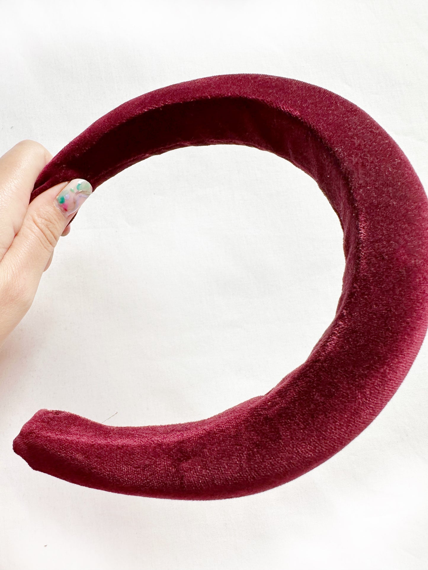 Padded headband in maroon red velvet