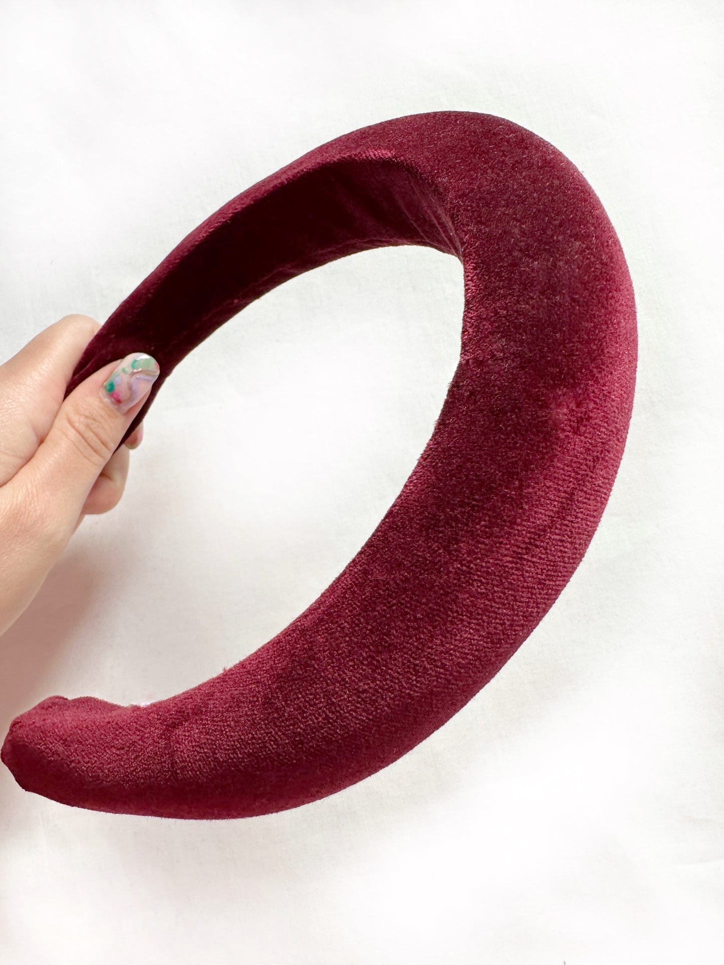 Padded headband in maroon red velvet