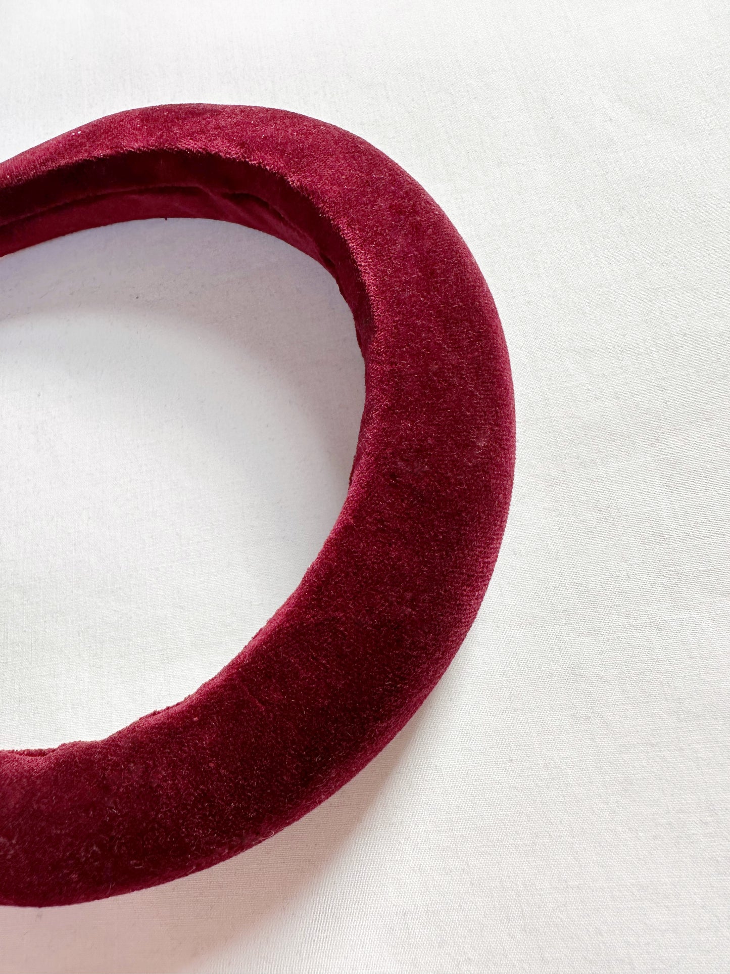 Padded headband in maroon red velvet