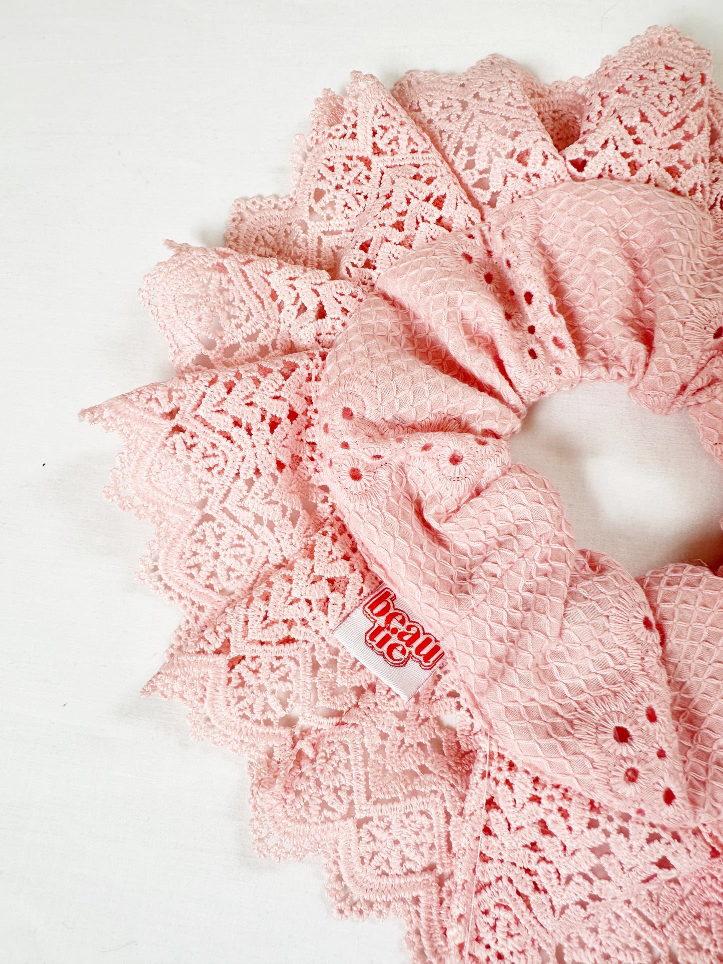 Oversized scrunchie in lace edge broderie pink cotton