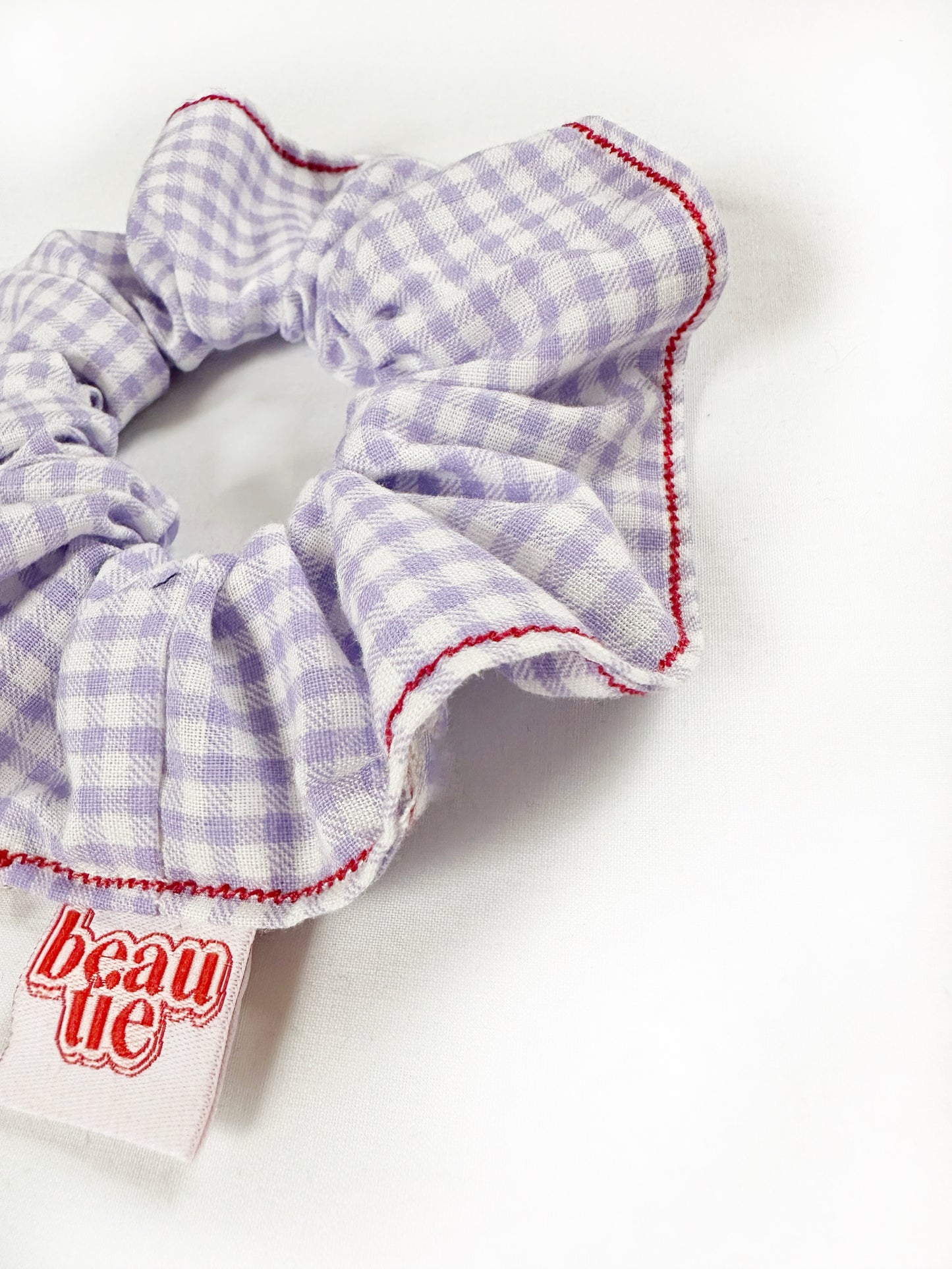 OG scrunchie in gingham and red stitch