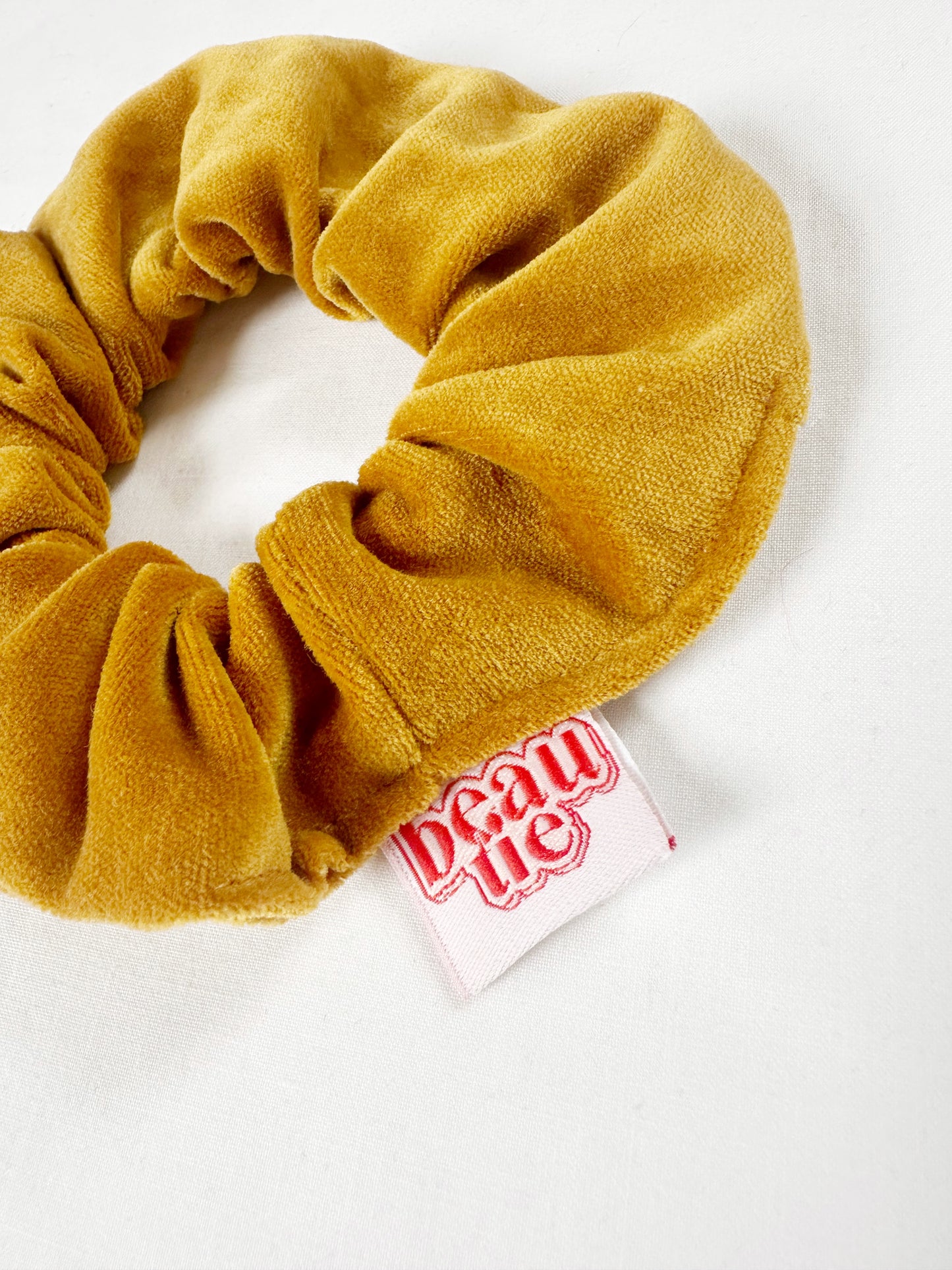 Mini scrunchie in mustard yellow velvet