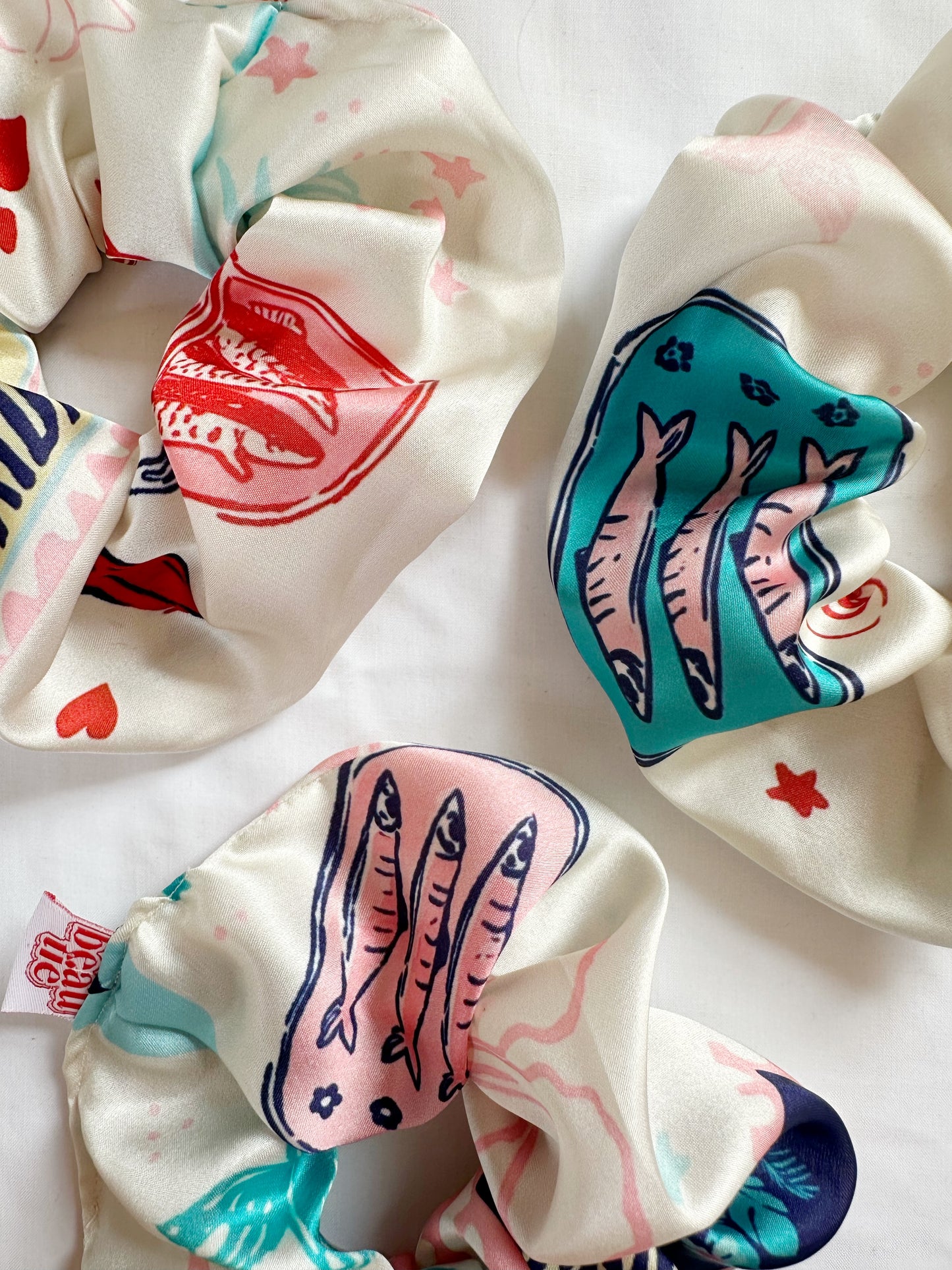 The OG scrunchie in silky sardine
