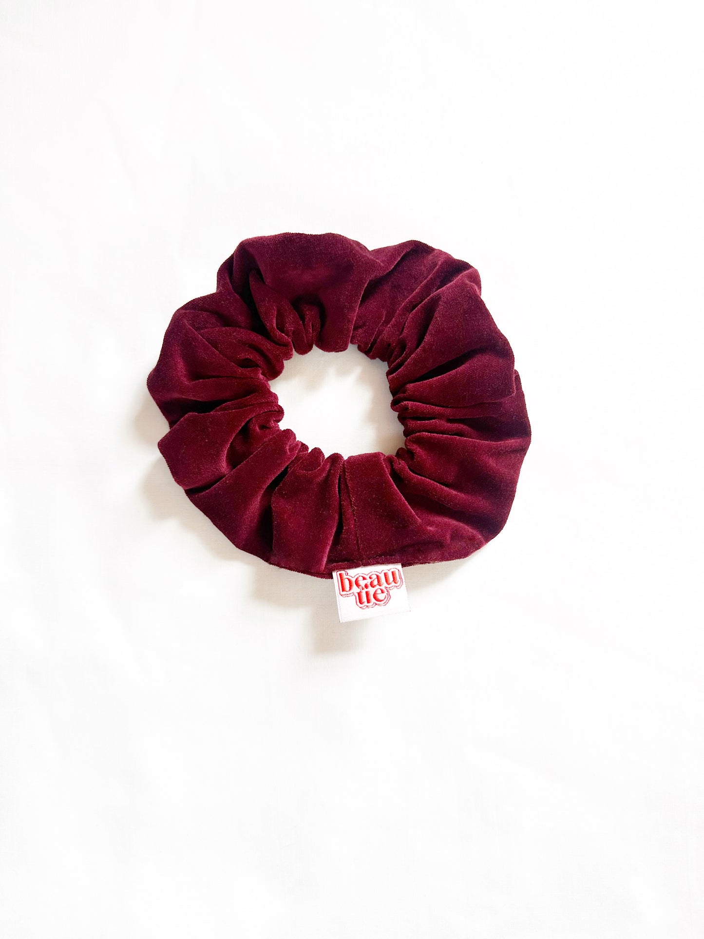 OG scrunchie in burgundy velvet