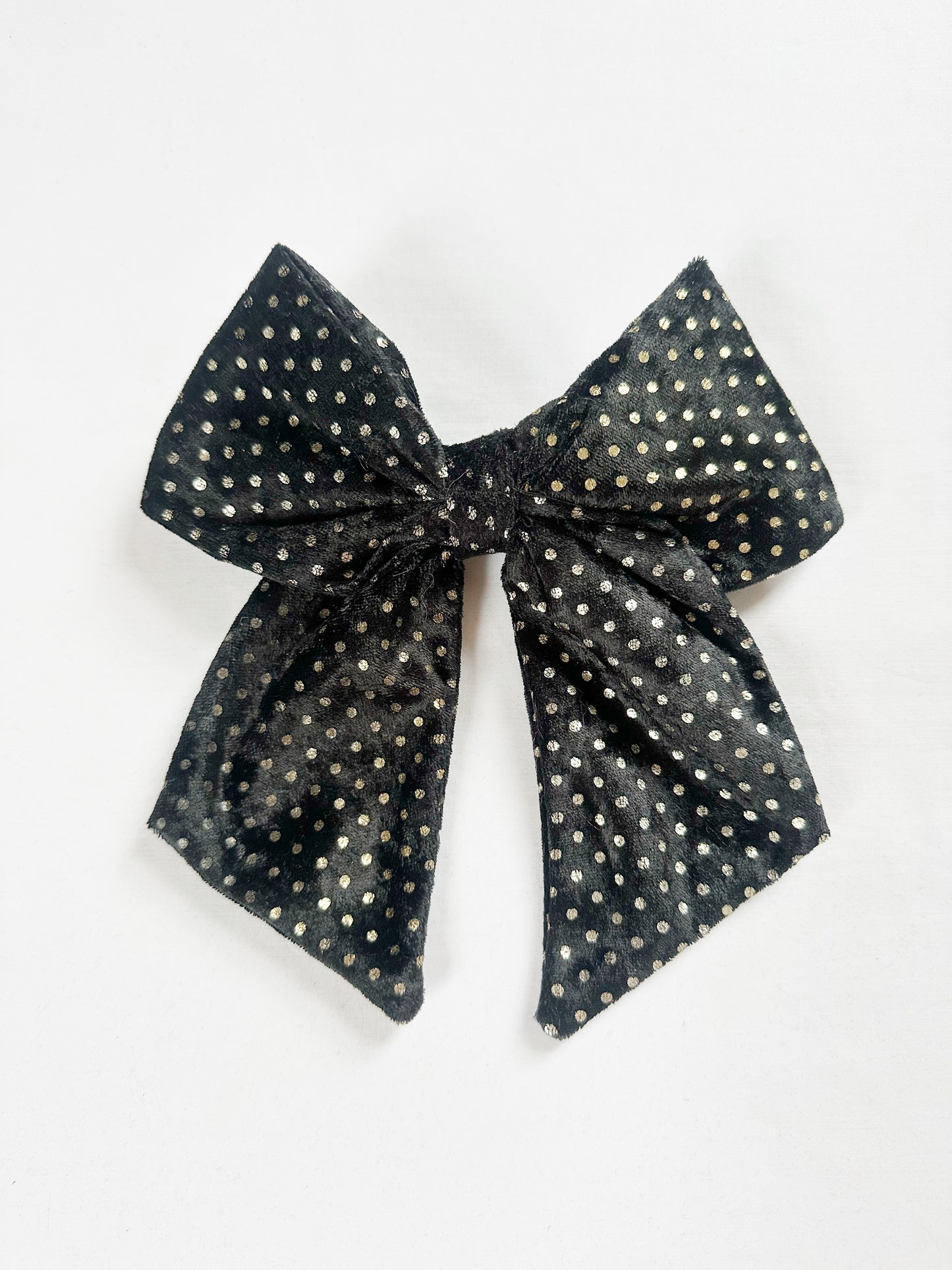 Beau hair bow in black and gold velvet