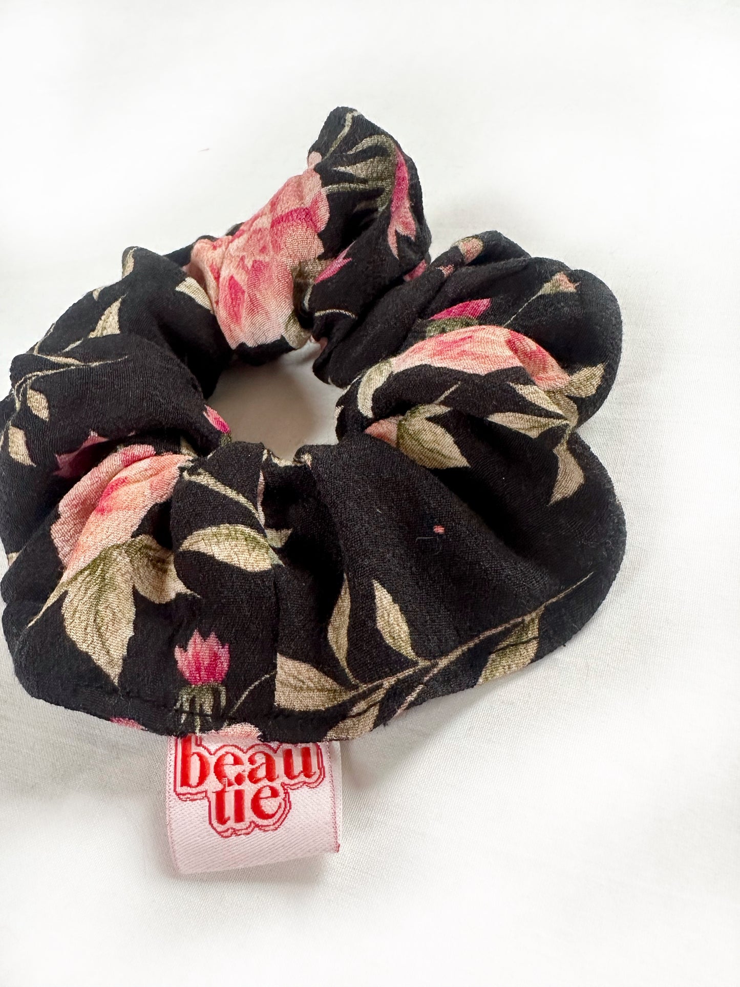 OG scrunchie in black and pink rose