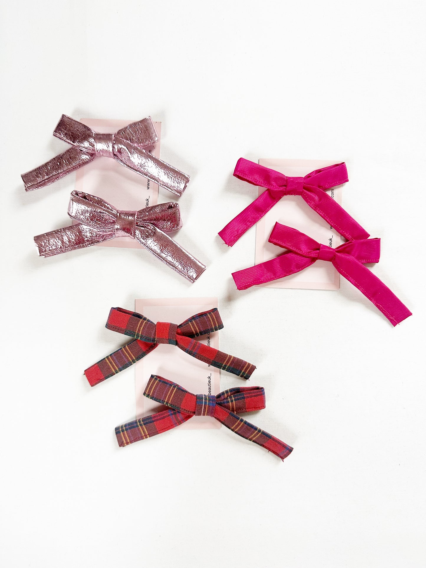 Bonnie mini hair bows in metallic pink