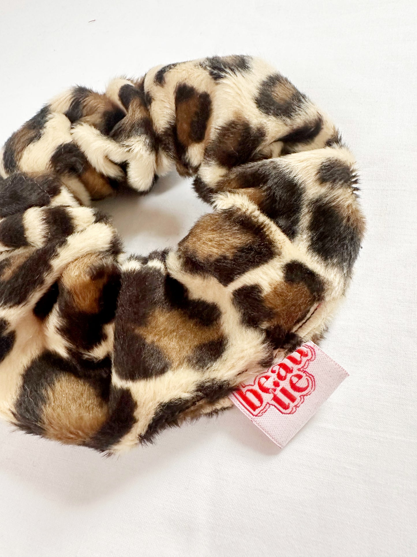 OG scrunchie in leopard faux fur