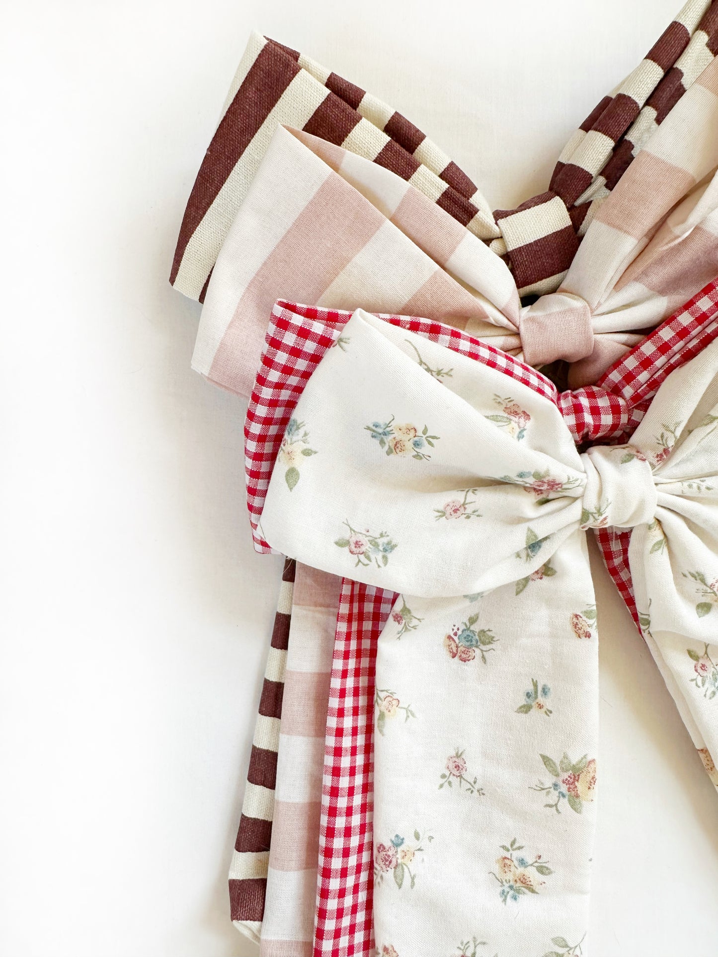 The Power Hair Bow in blush and white stripe