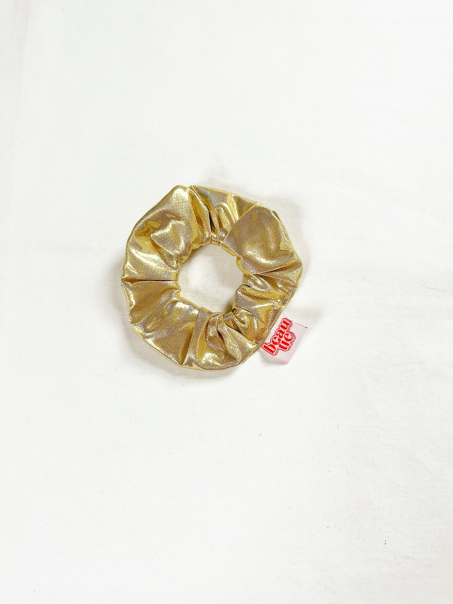 Mini scrunchie in gold