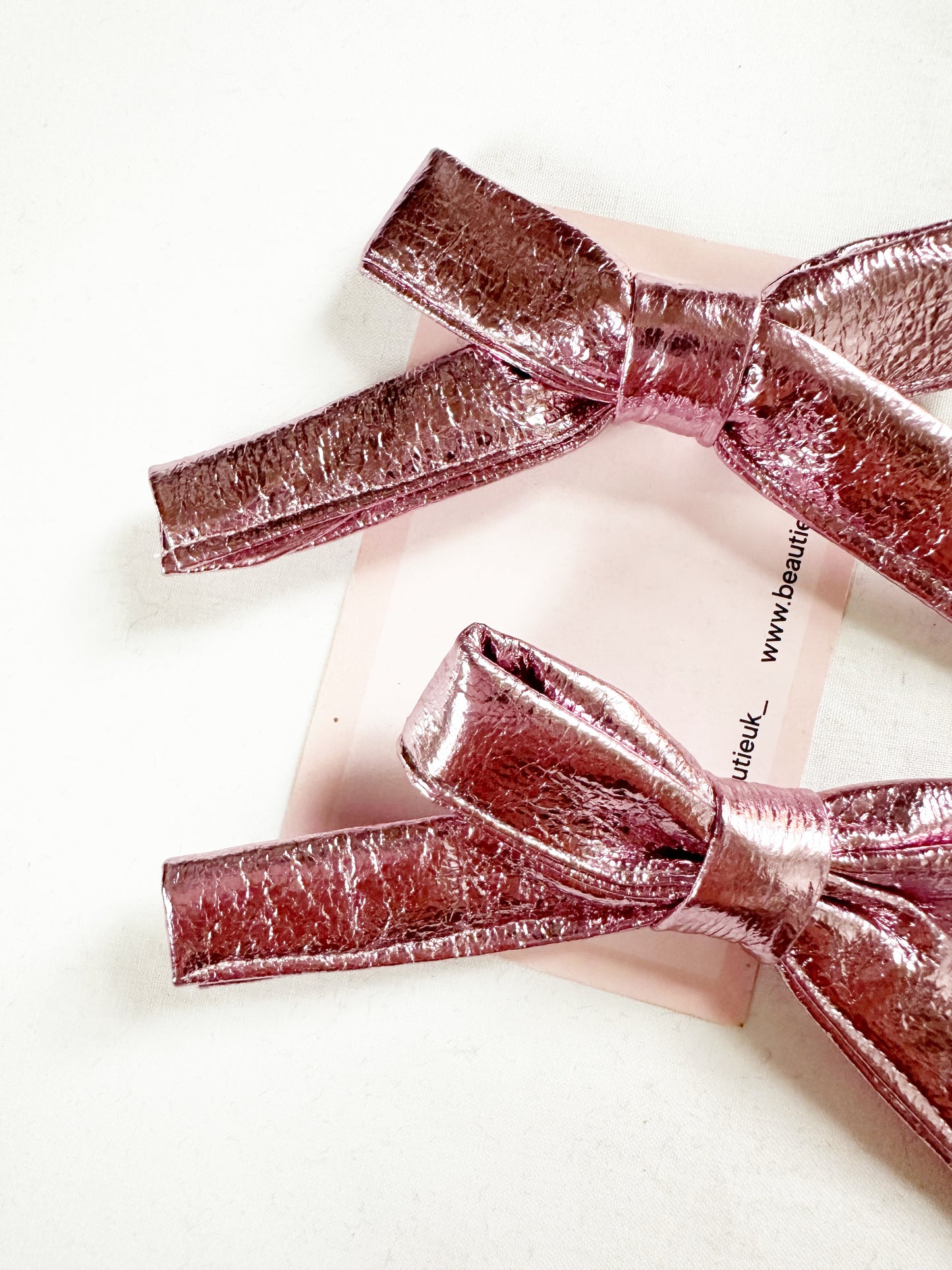 Bonnie mini hair bows in metallic pink