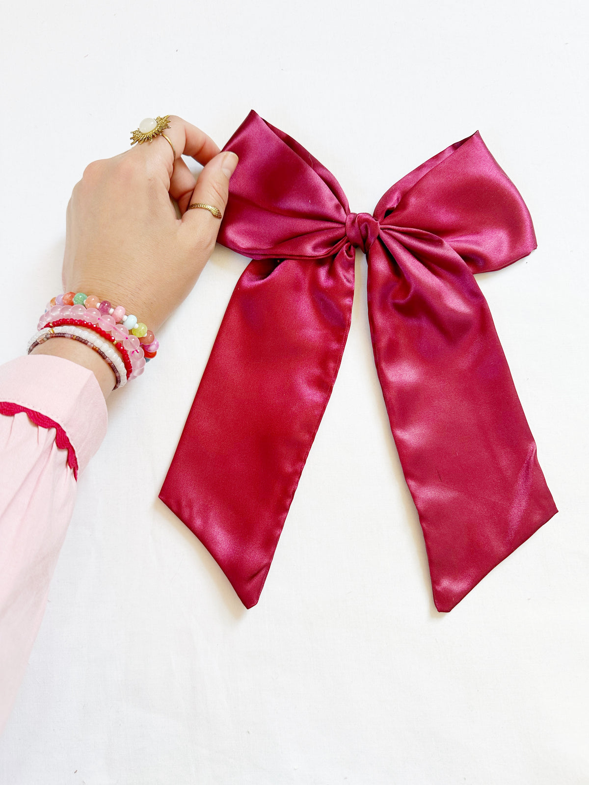 The Power Hair Bow in burgundy silk