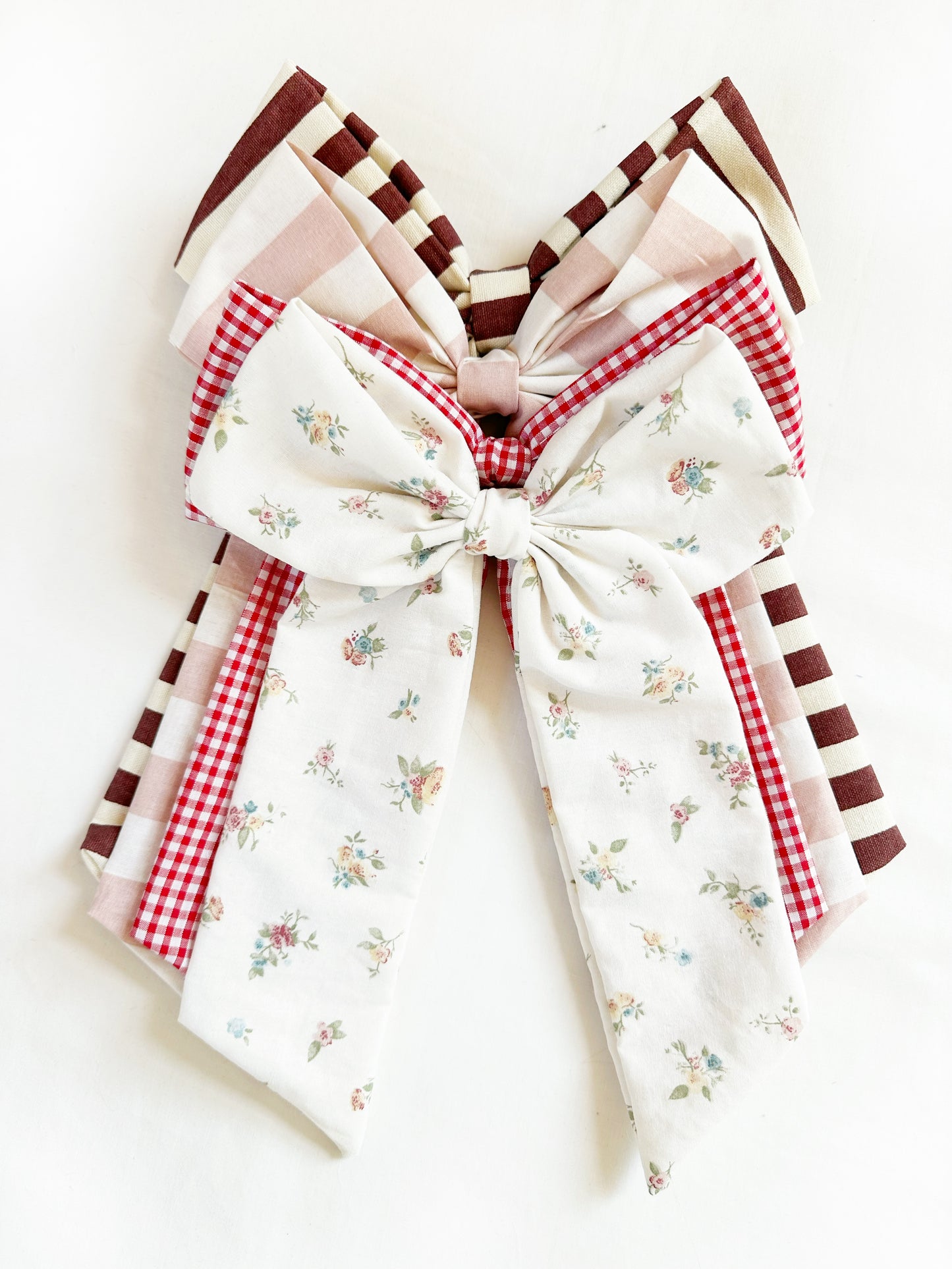 The Power Hair Bow in blush and white stripe