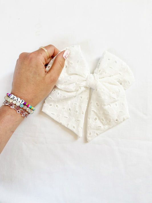 Beau hair bow in white broderie