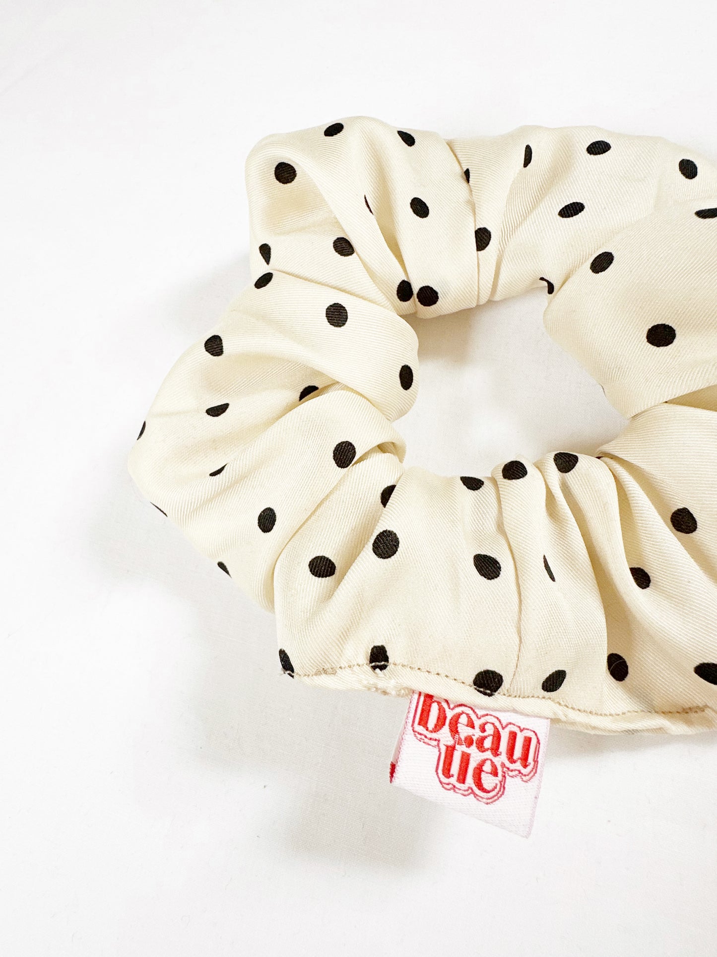 OG scrunchie in cream polka dot