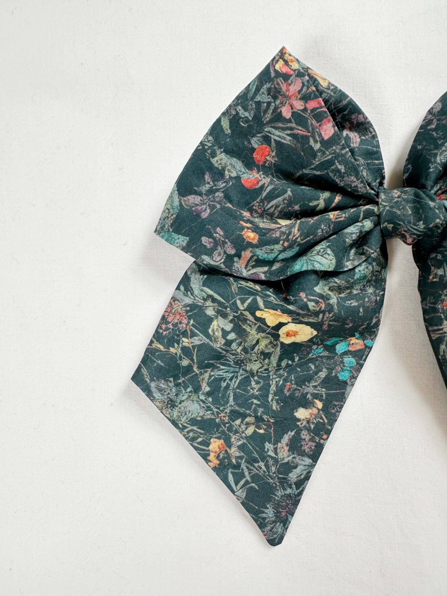 Liberty Beau hair bow in dark green wildflowers
