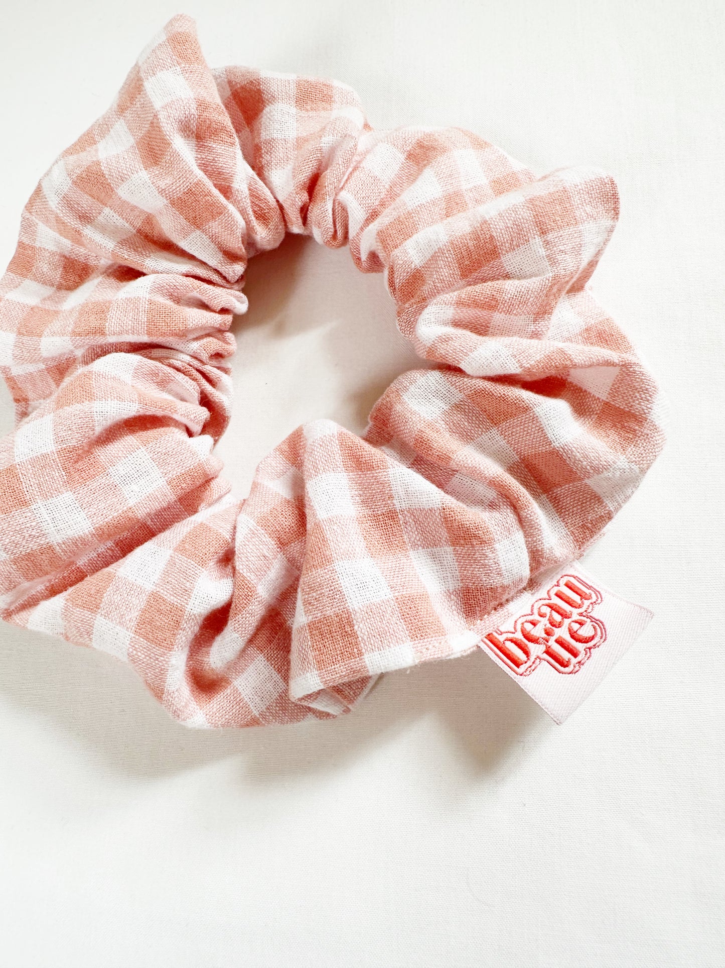 OG scrunchie in peach gingham