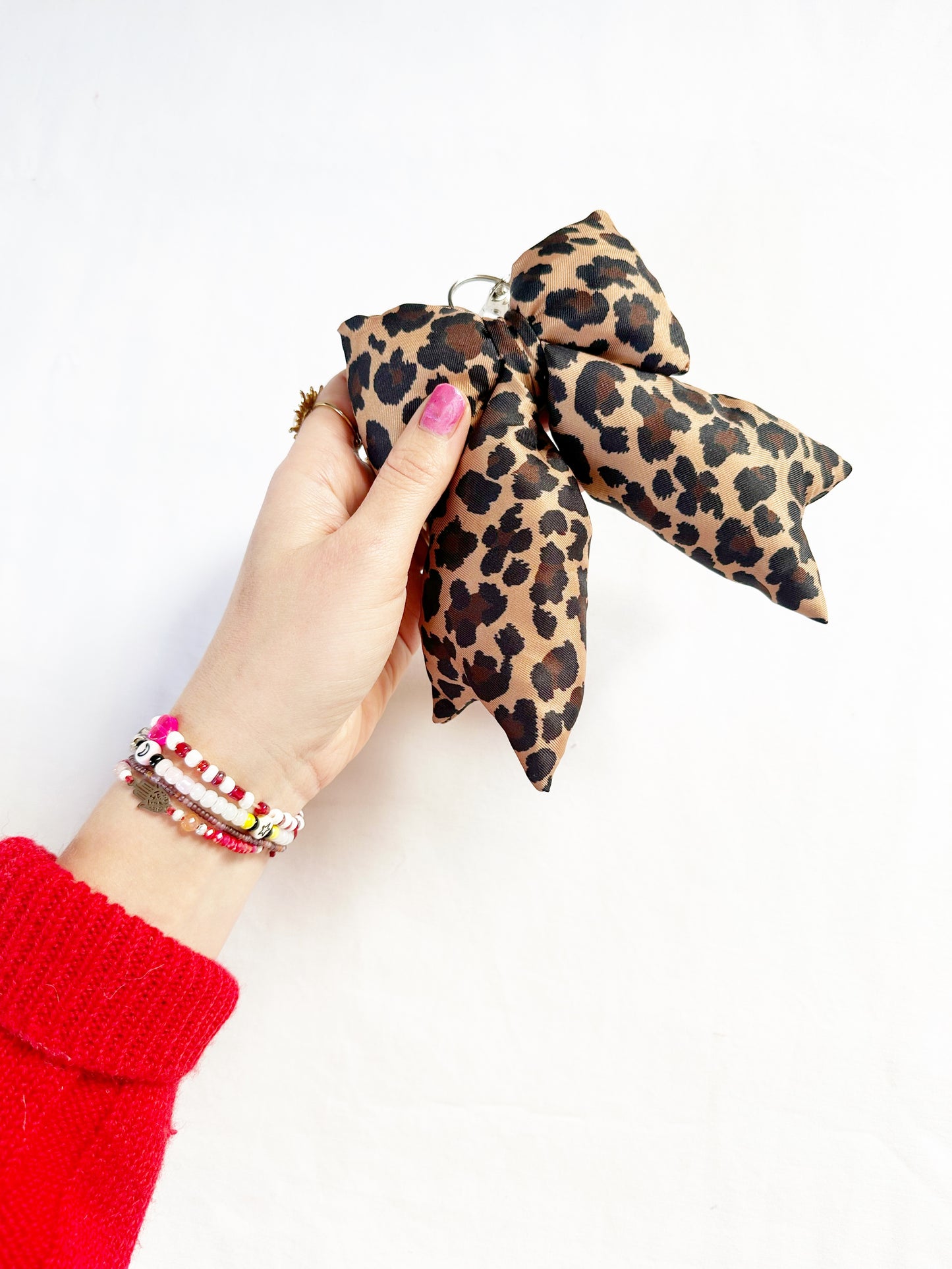 Puffy bow bag charm in leopard print