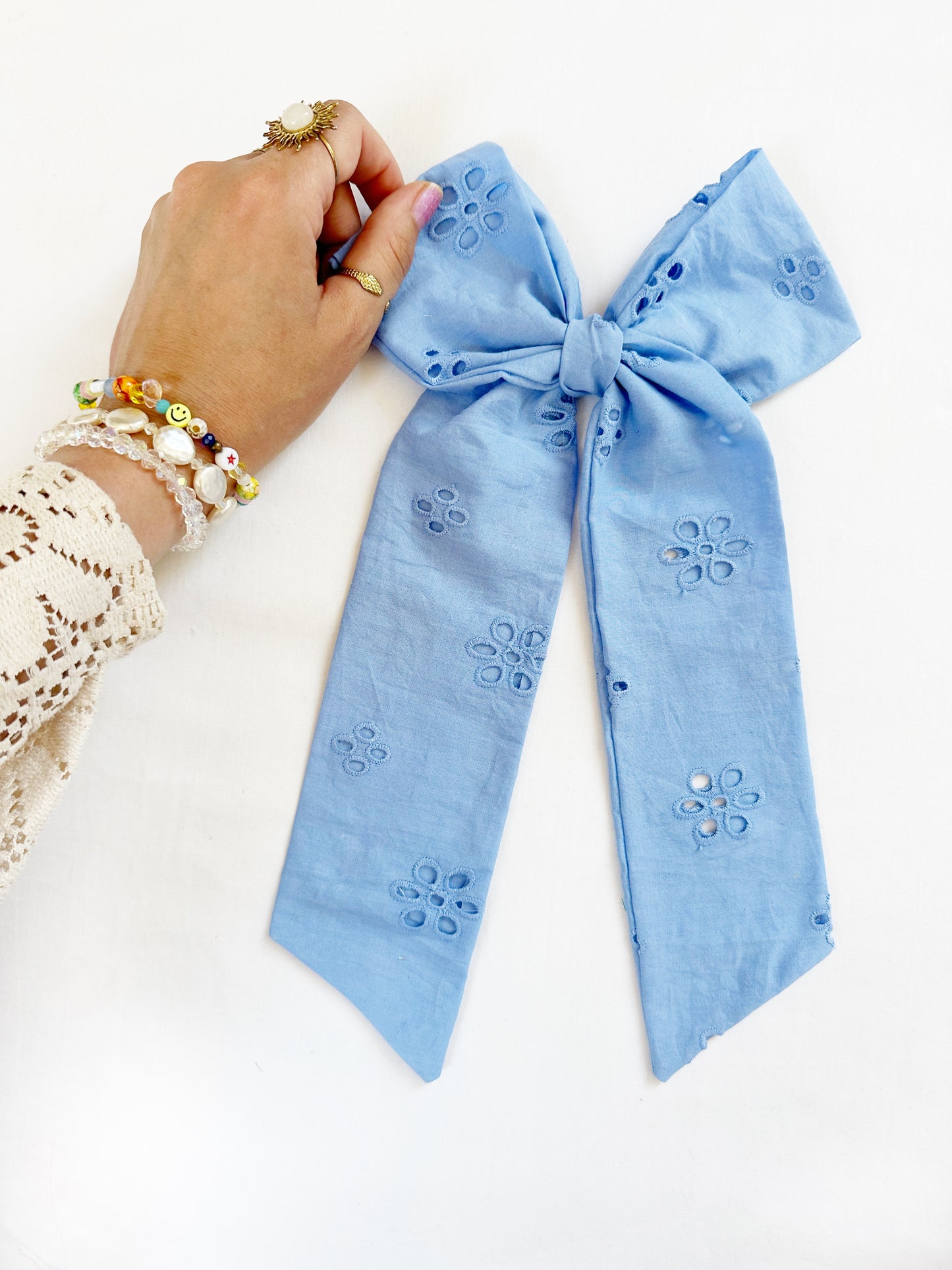 The Power Hair Bow in blue Broderie