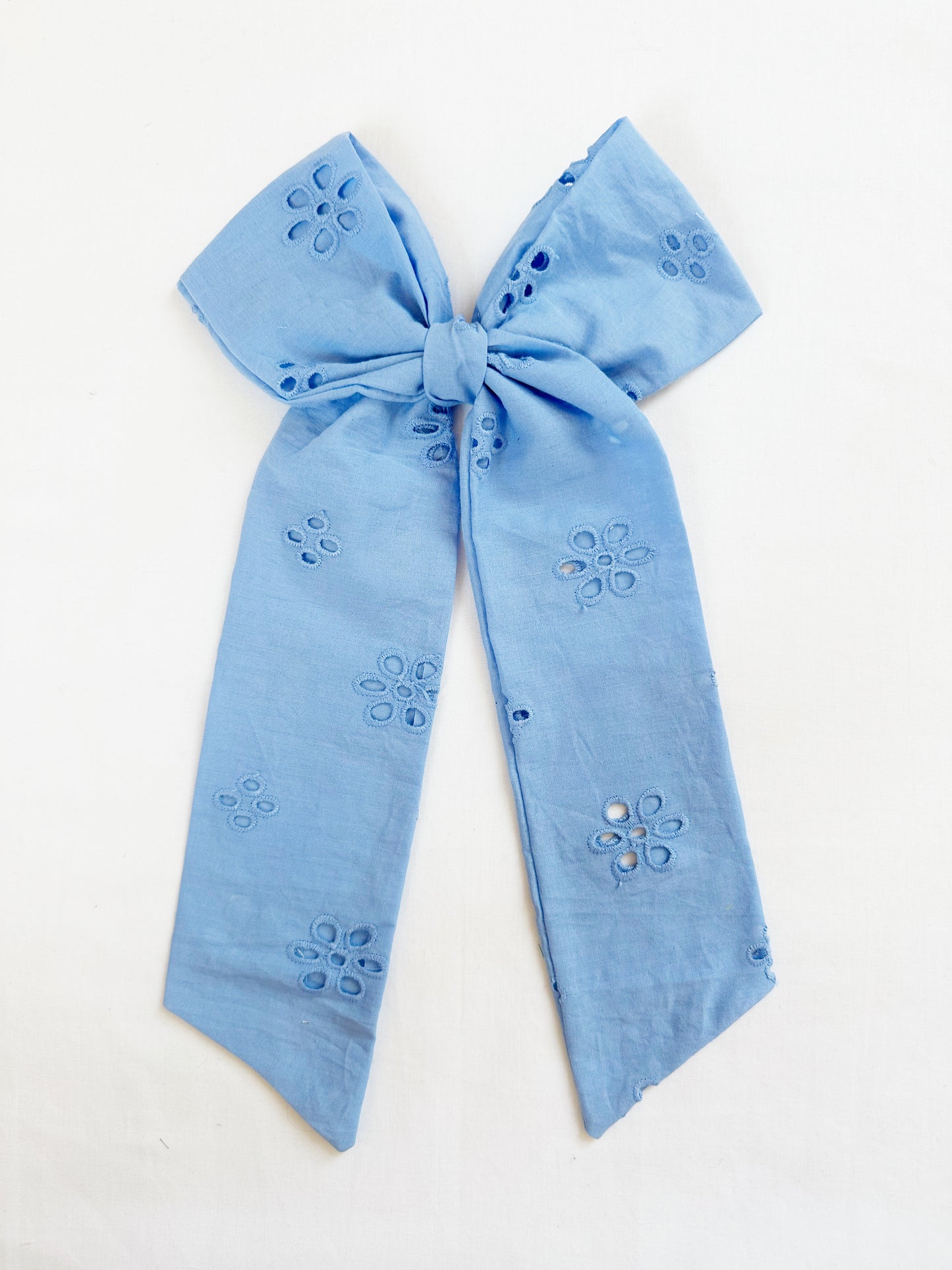 The Power Hair Bow in blue Broderie