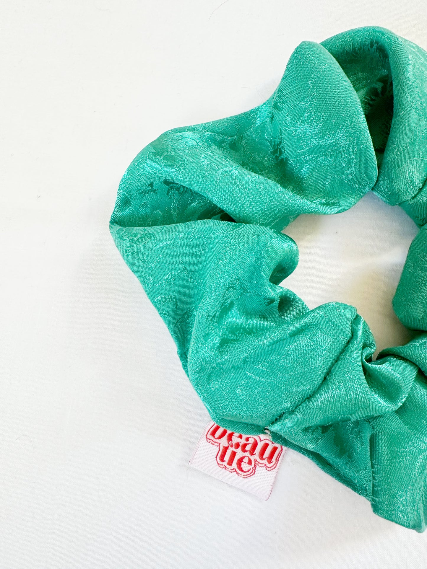 OG scrunchie in turquoise silky floral